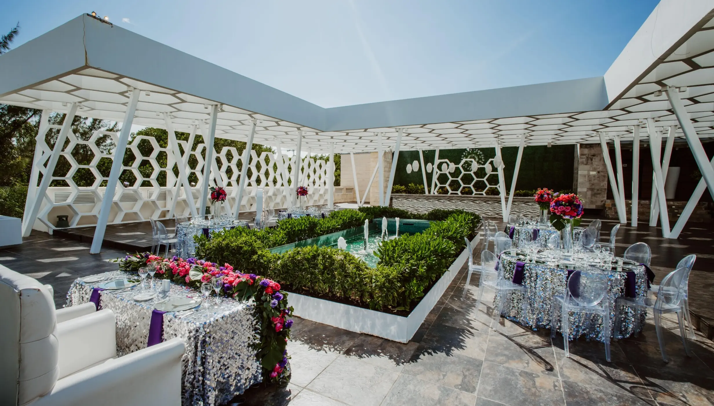 Rooftop terrace wedding reception with sequined linens at Sandos Caracol, Playa Del Carmen