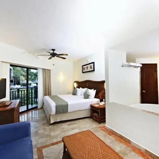 Deluxe guest room with a king bed and open bathtub area at Sandos Caracol, Playa Del Carmen