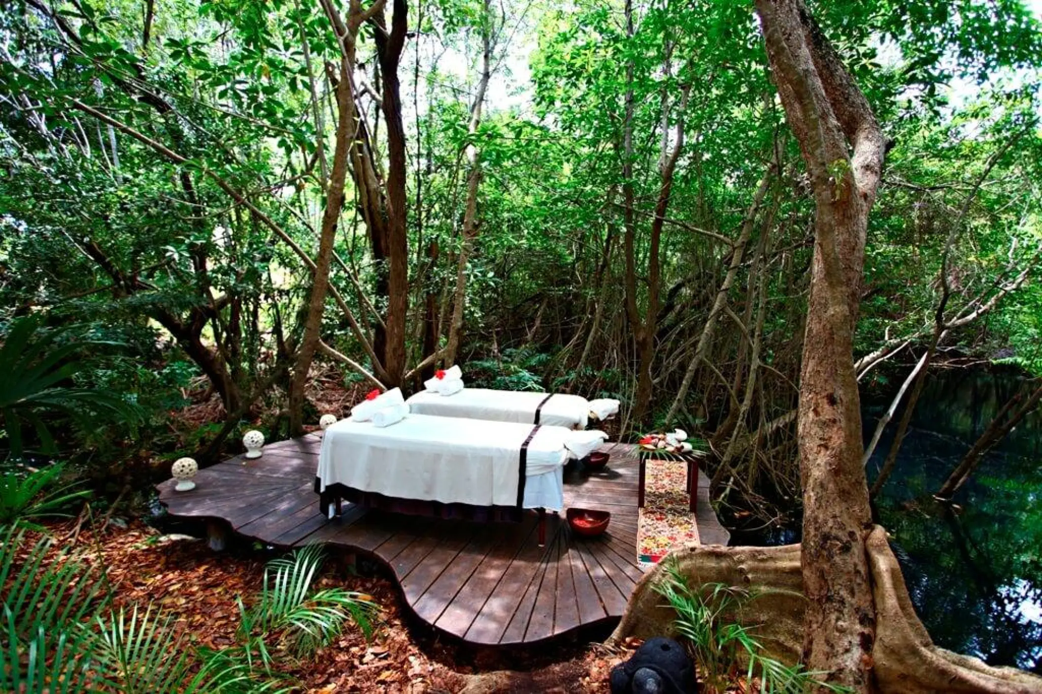 Outdoor spa treatment deck surrounded by mangroves and jungle at Sandos Caracol, Playa Del Carmen