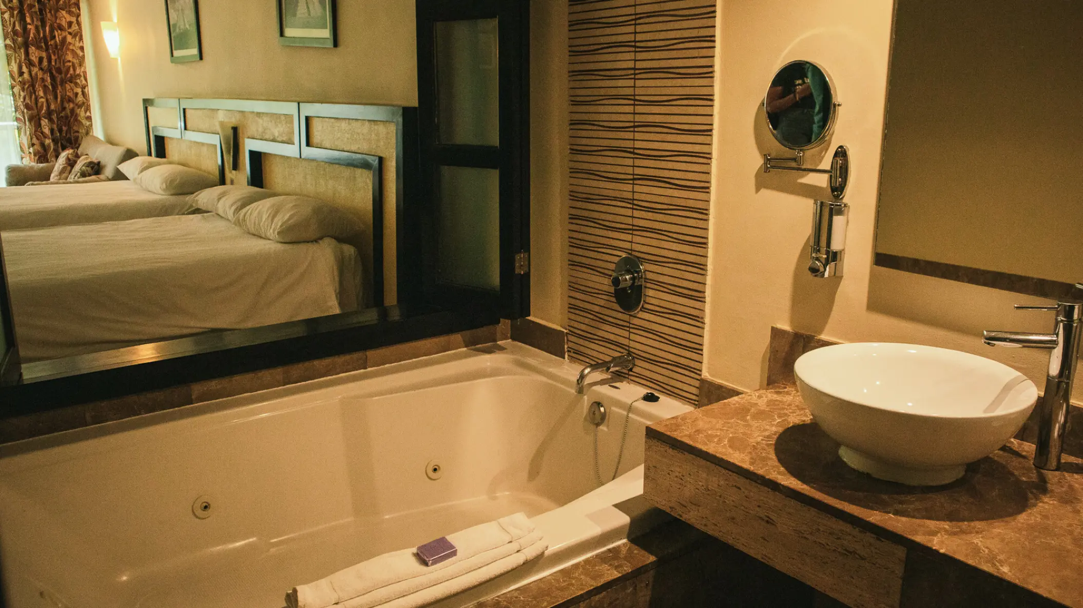 Sandos Playacar suite bathroom with a large jetted bathtub and vessel sink vanity, Playa Del Carmen