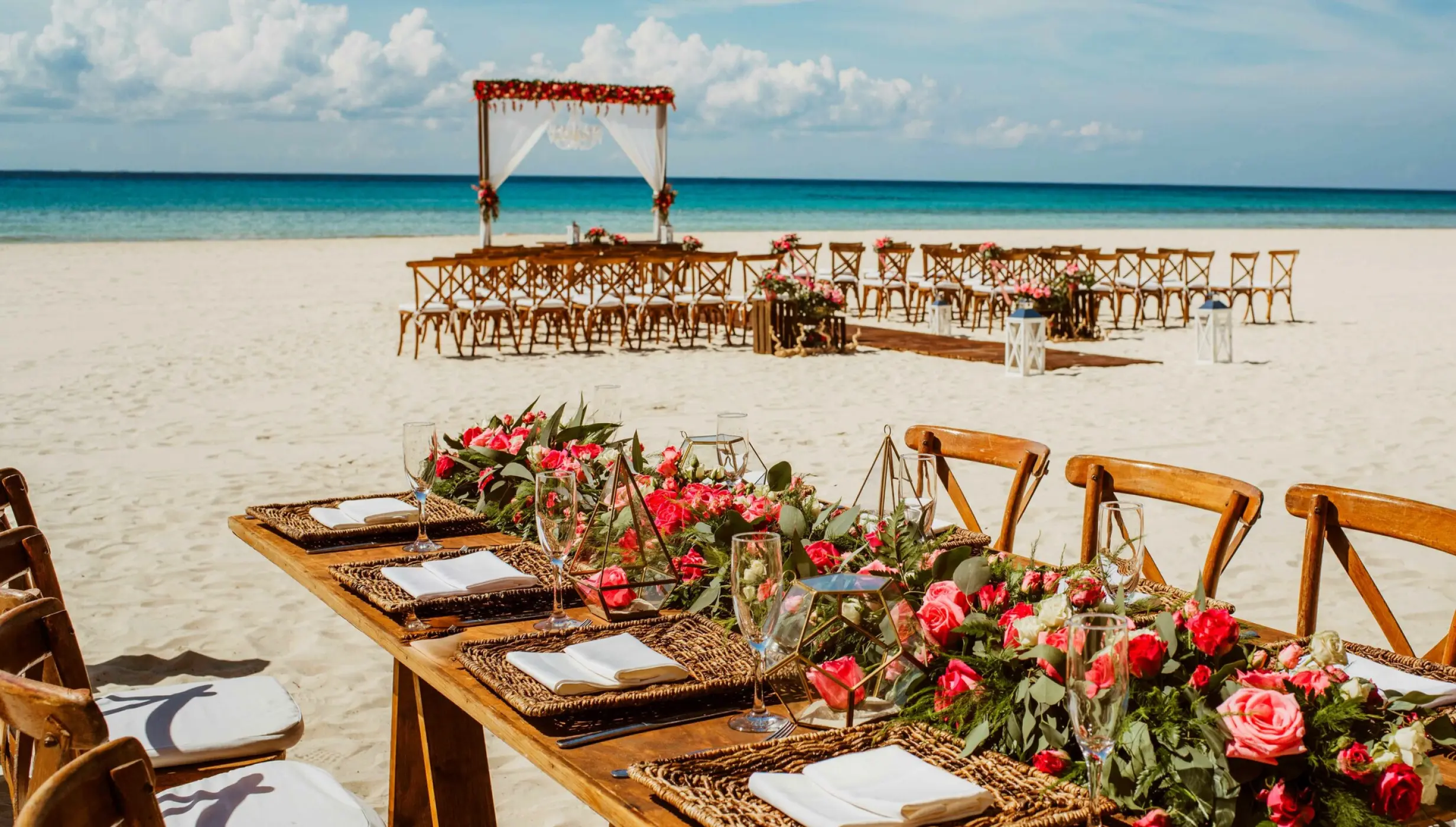 Ceremony and dinner decor on the beach wedding venue at Sandos Playacar Beach Resort
