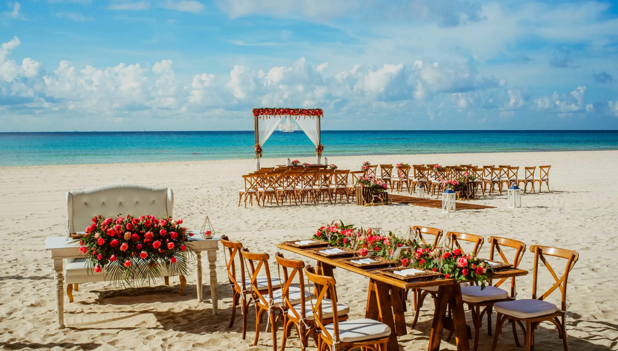 Ceremony and dinner decor on the beach wedding venue at Sandos Playacar Beach Resort