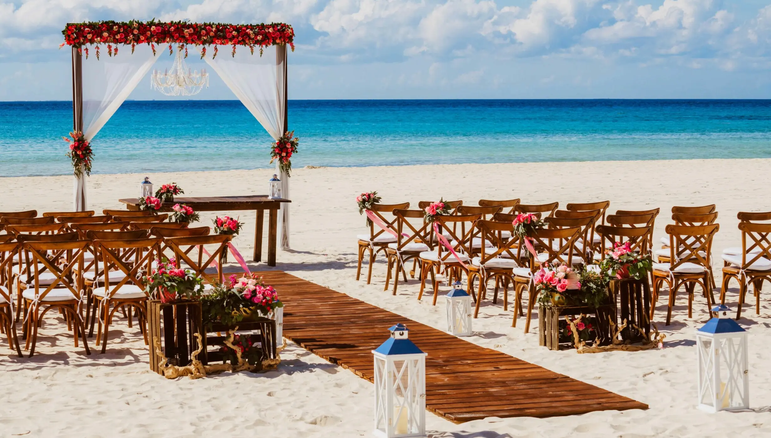 Ceremony and dinner decor on the beach wedding venue at Sandos Playacar Beach Resort