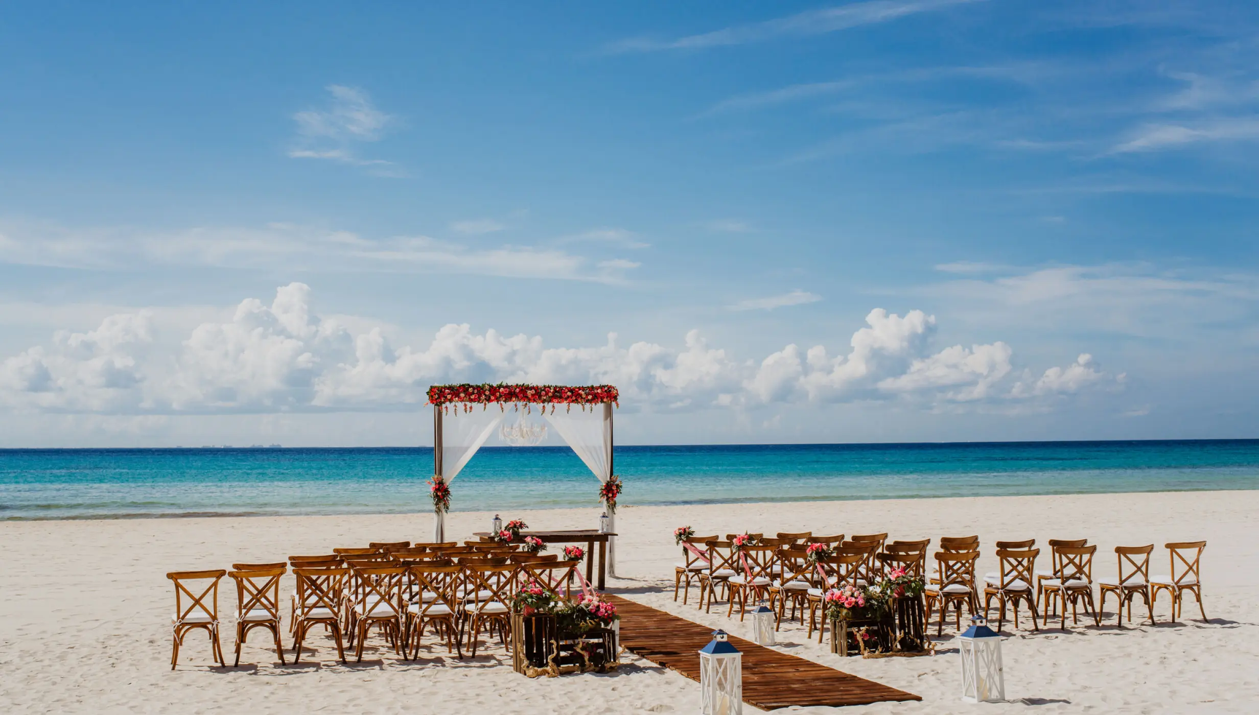 Ceremony and dinner decor on the beach wedding venue at Sandos Playacar Beach Resort