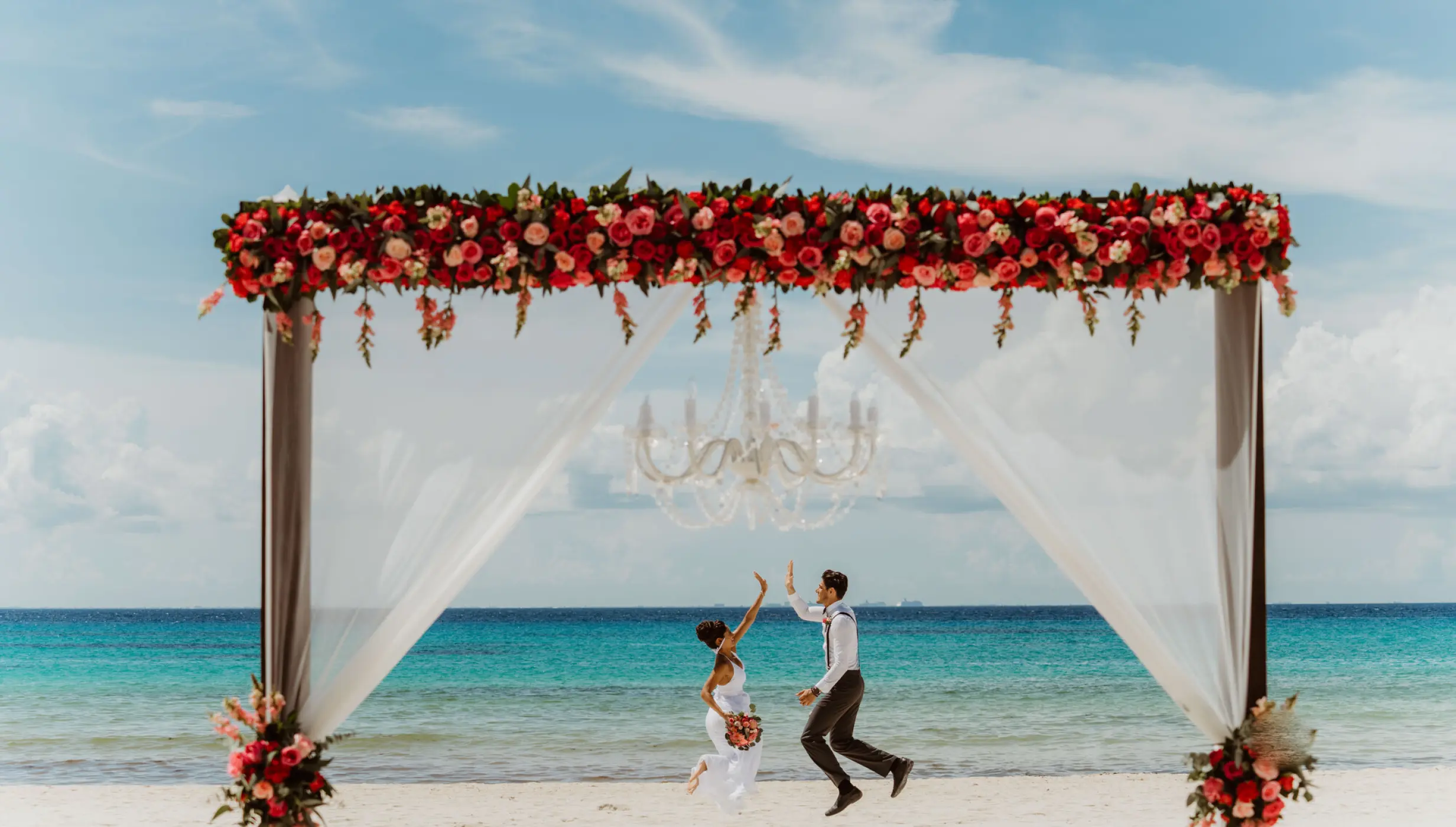 Ceremony and dinner decor on the beach wedding venue at Sandos Playacar Beach Resort