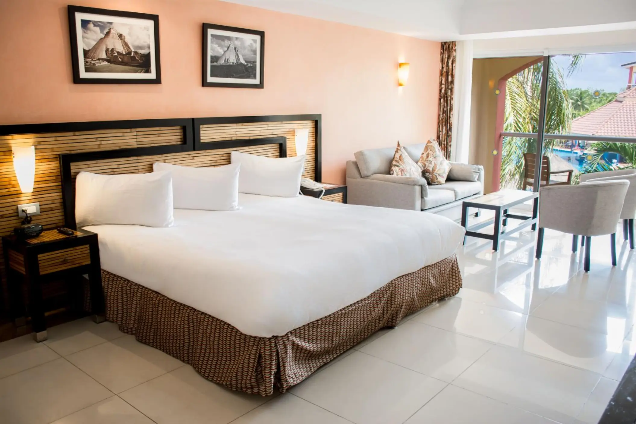 Junior suite with large bed and seating area at Sandos Playacar, Playa Del Carmen