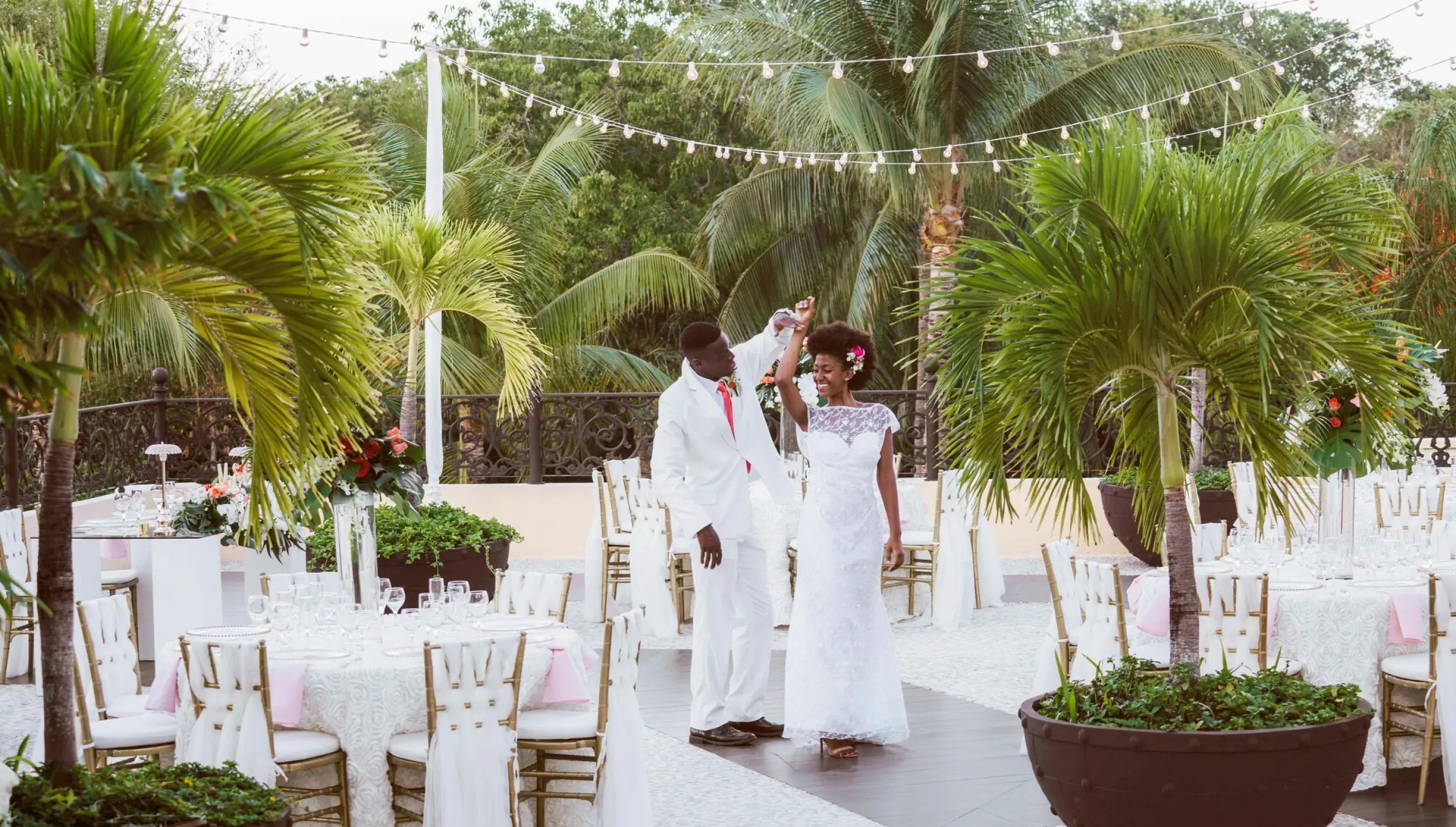 Couple dancing on the terrace wedding venue at Sandos Playacar Beach Resort