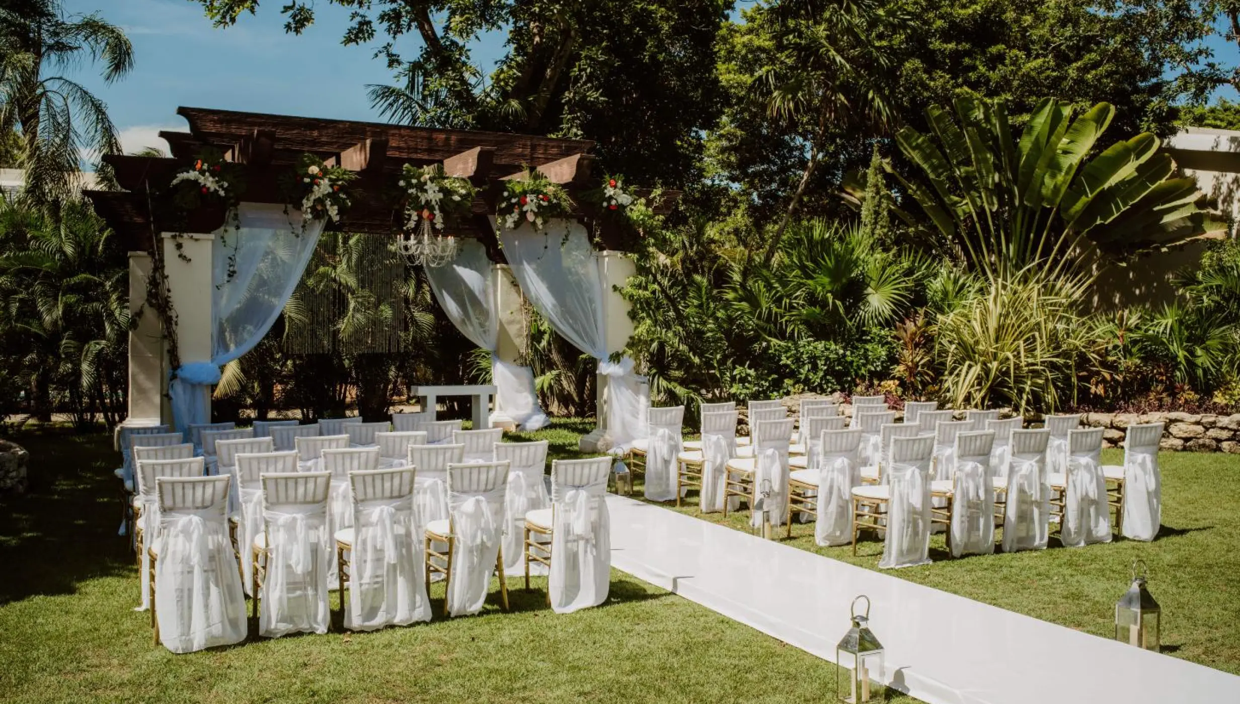 Ceremony decor on the garden wedding venue at Sandos Playacar Beach Resort