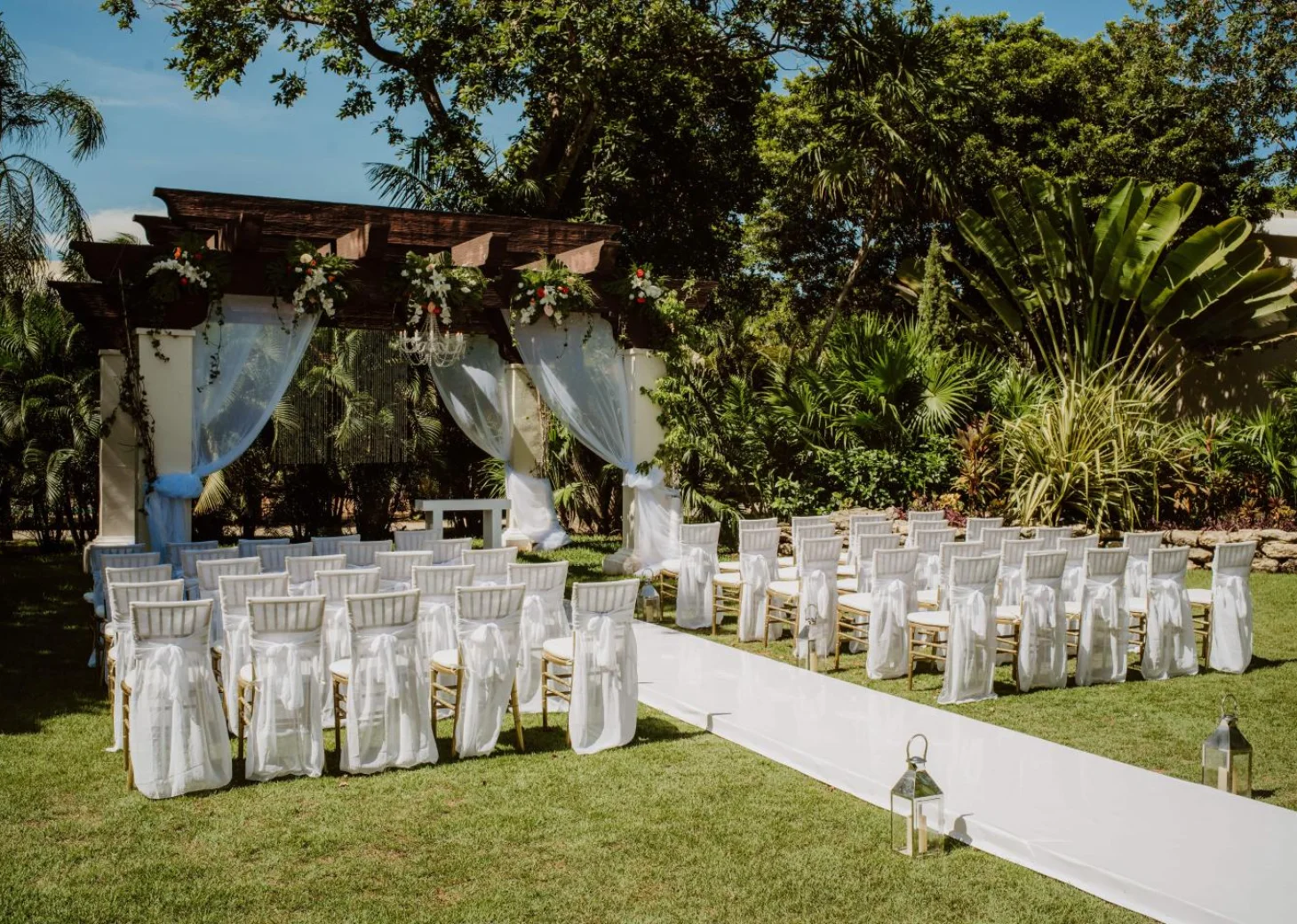 Ceremony decor on the garden wedding venue at Sandos Playacar Beach Resort