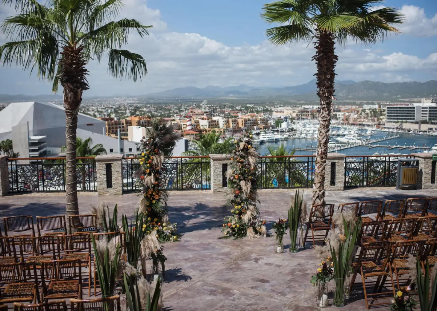 Terrace wedding ceremony at Sandos Finisterra overlooking the marina, Cabo San Lucas