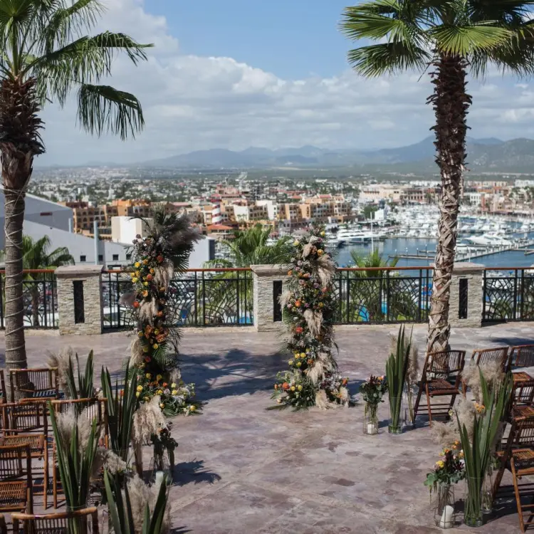 Terrace wedding ceremony at Sandos Finisterra overlooking the marina, Cabo San Lucas