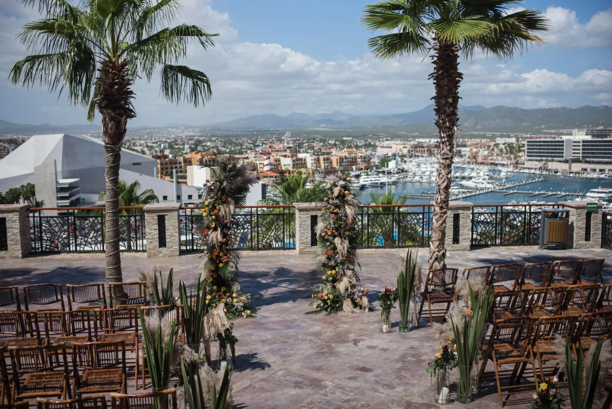 Terrace wedding ceremony at Sandos Finisterra overlooking the marina, Cabo San Lucas