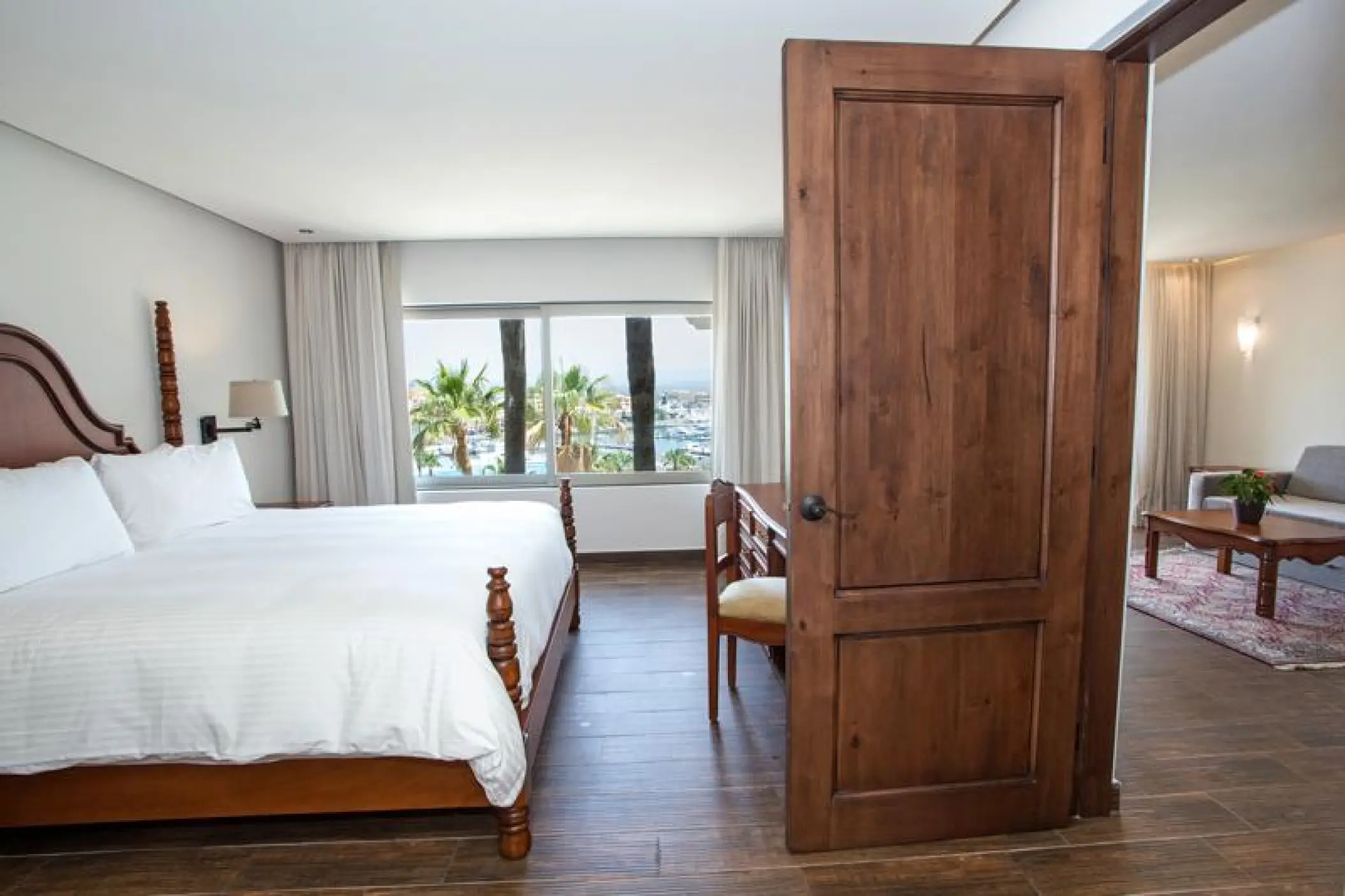 Finisterra Casitas Suite with wood furnishings at Sandos Finisterra, Cabo San Lucas