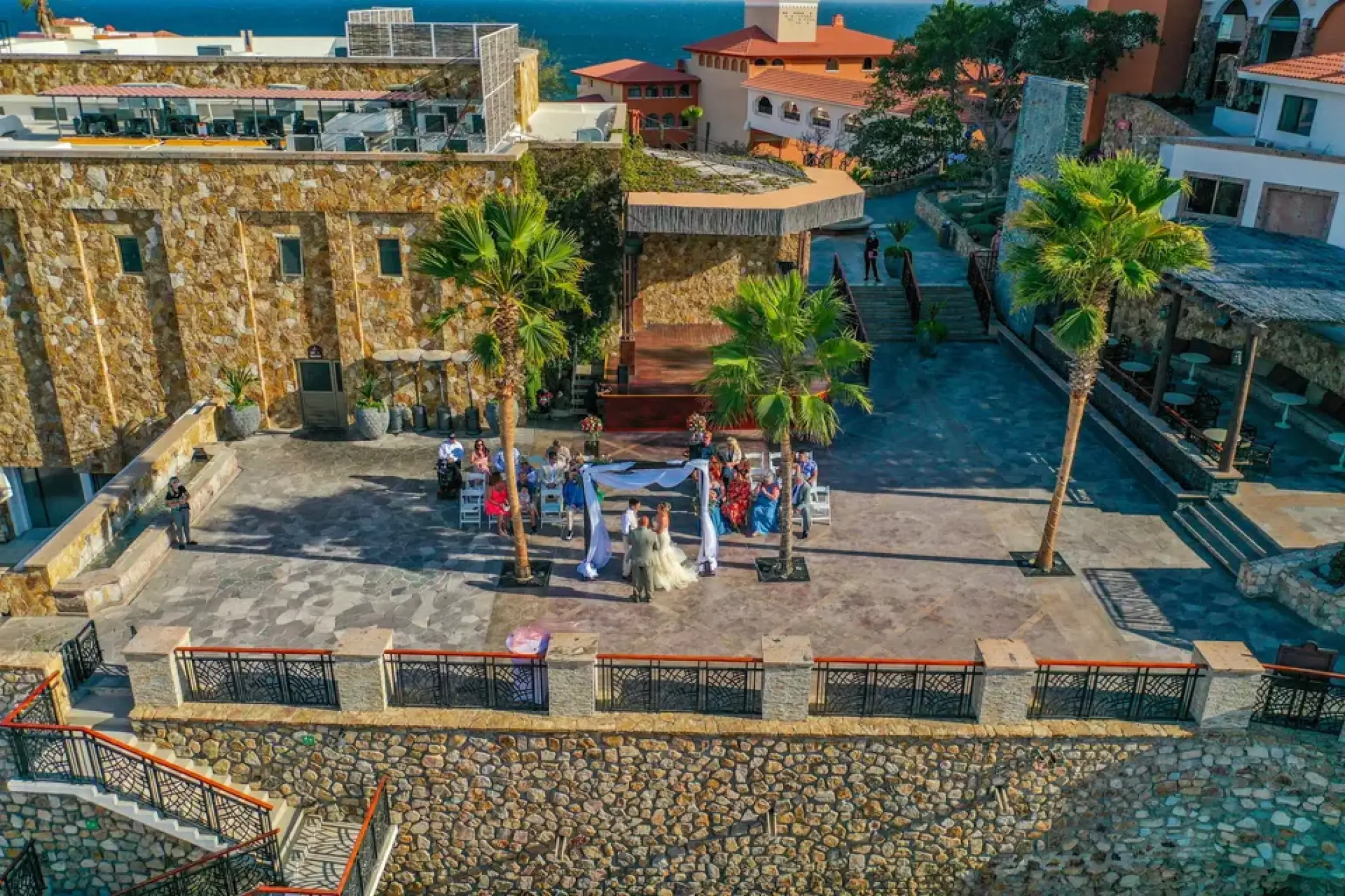 Plaza Finisterra wedding ceremony on the stone terrace at Sandos Finisterra, Cabo San Lucas