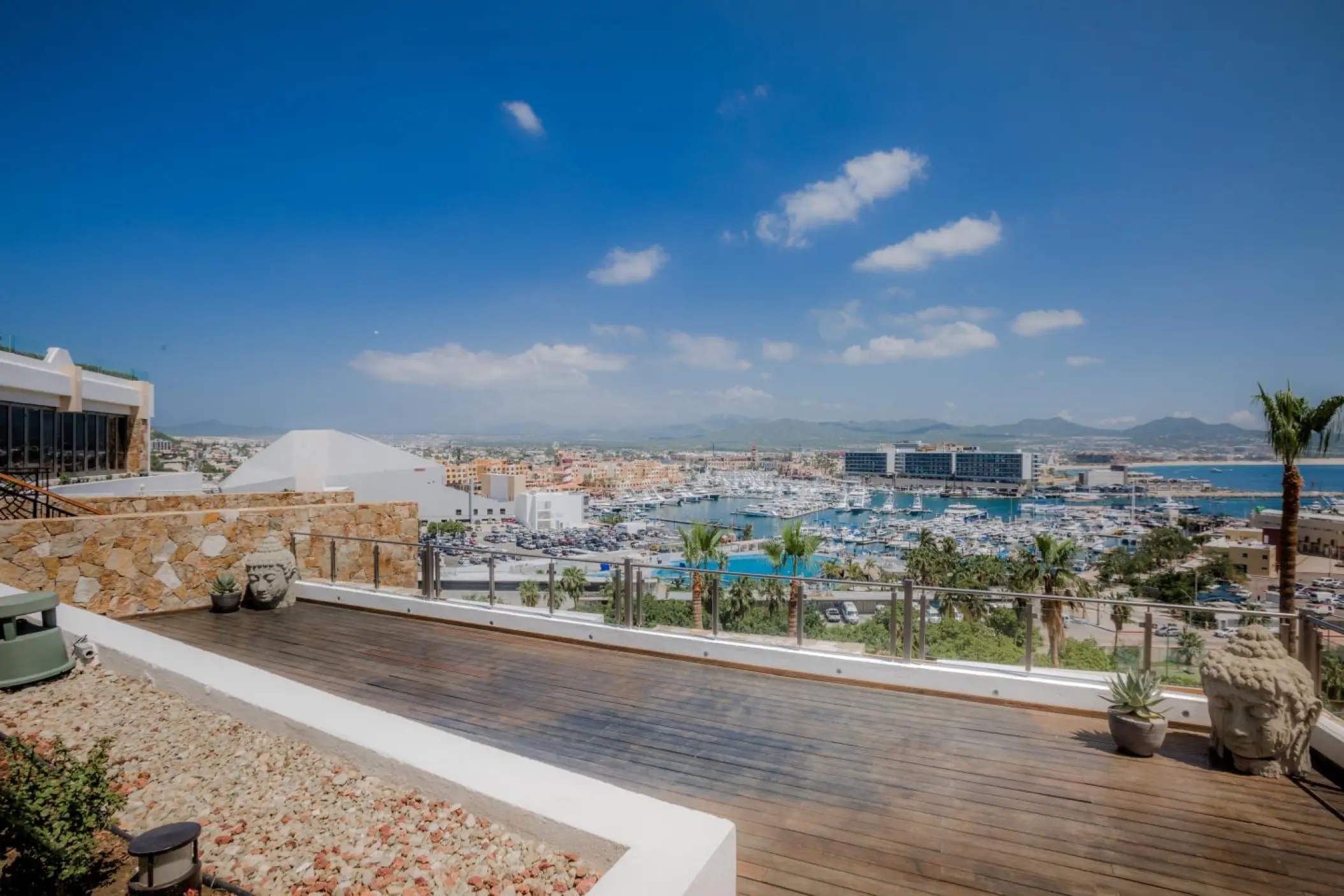 Outdoor spa terrace with Buddha statues overlooking the marina at Sandos Finisterra, Cabo San Lucas