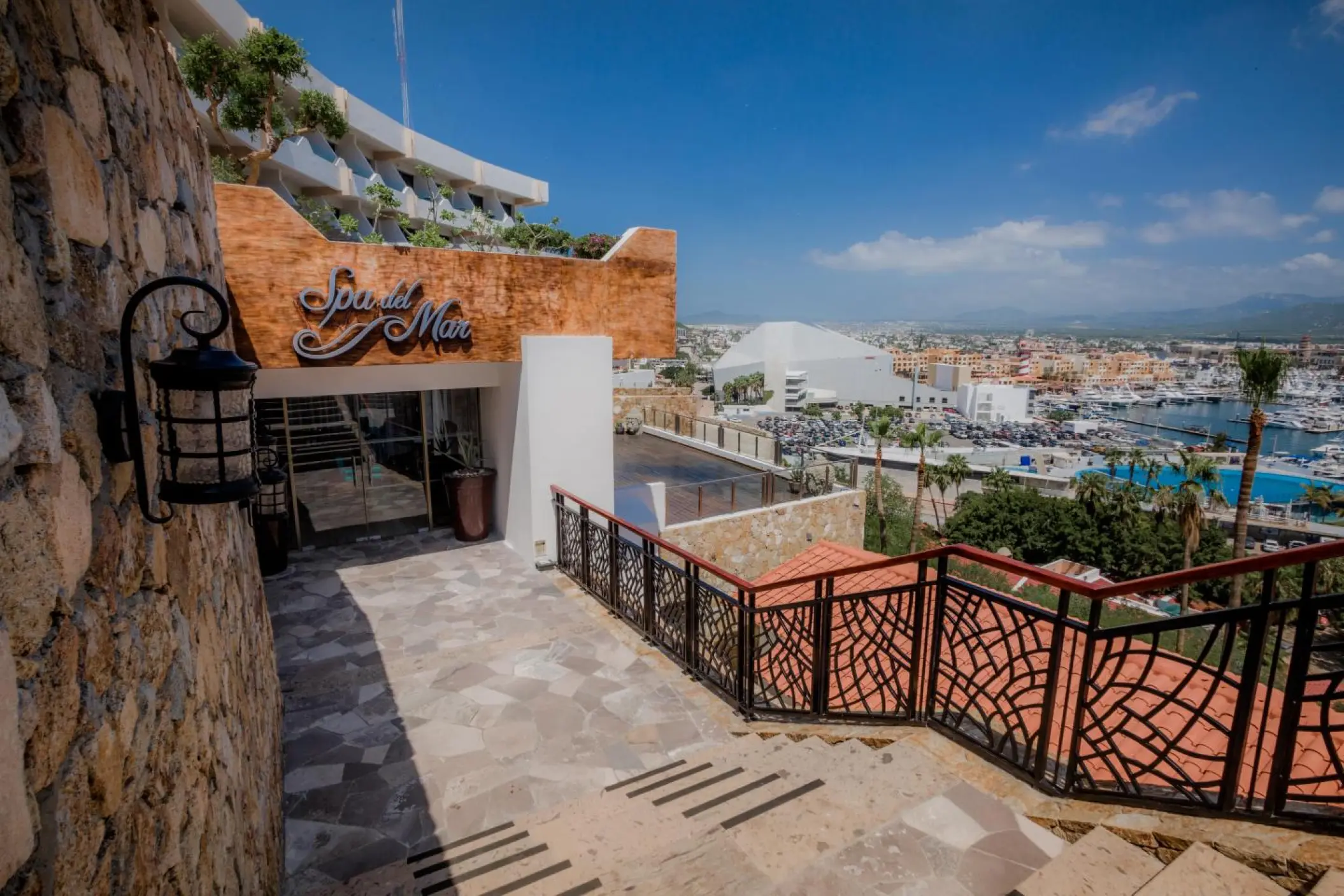 Spa Sandos entrance and stone staircase overlooking the marina at Sandos Finisterra, Cabo San Lucas