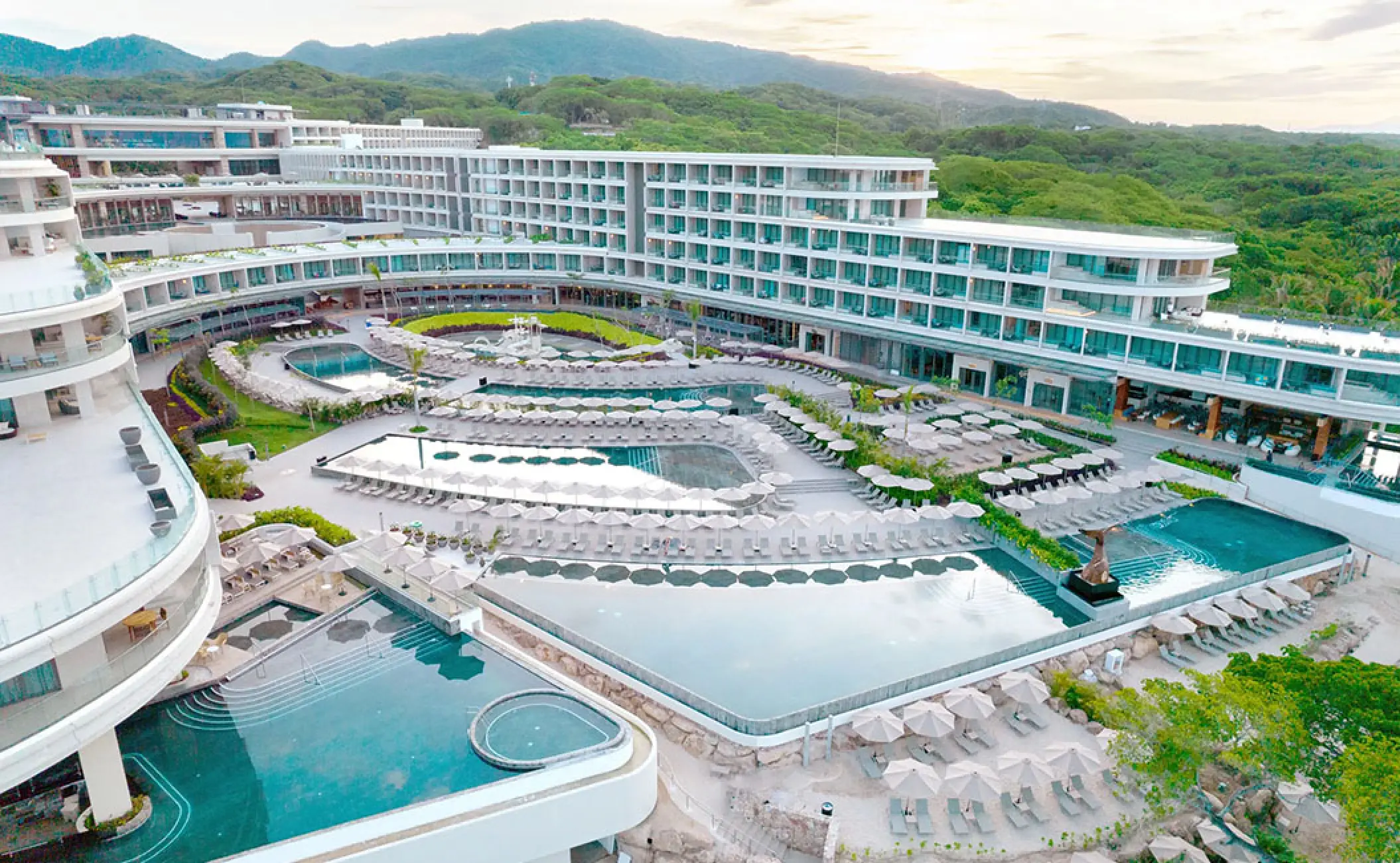 Aerial view of the modern pools and tiered architecture at Secrets Bahia Mita, Puerto Vallarta