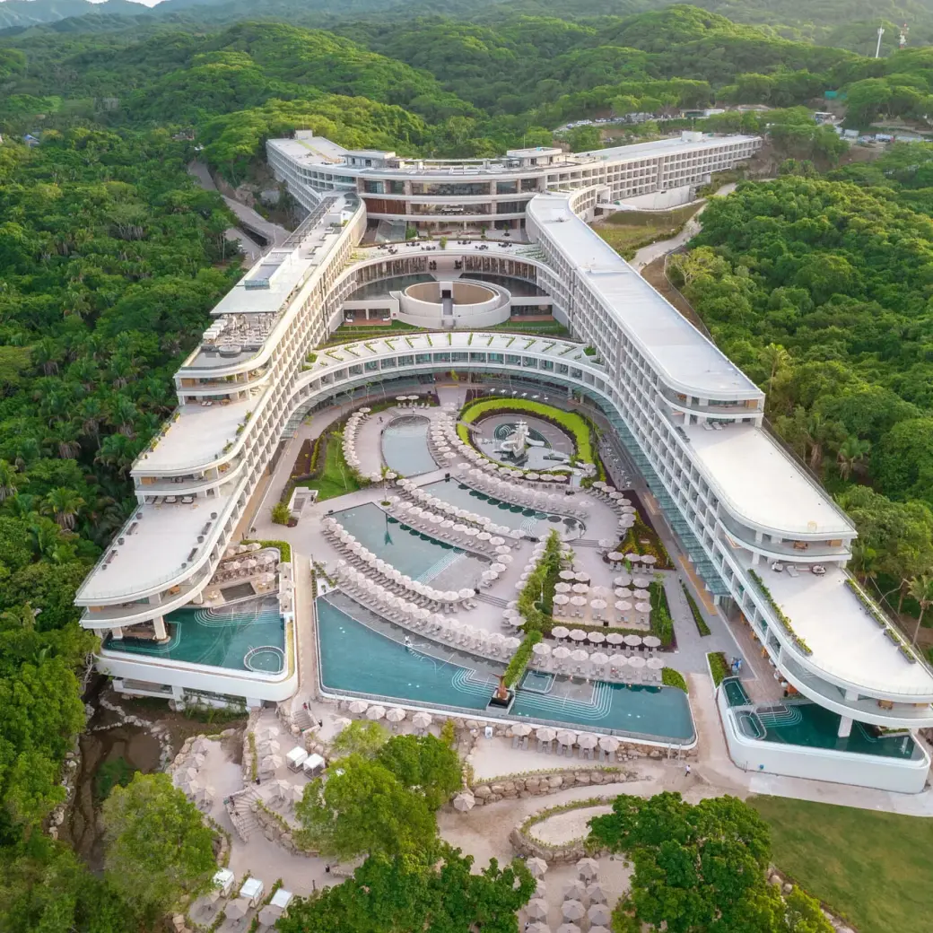 Aerial view of Secrets Bahia Mita pools and modern architecture surrounded by lush jungle, Puerto Vallarta
