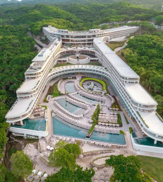 Aerial view of Secrets Bahia Mita pools and modern architecture surrounded by lush jungle, Puerto Vallarta