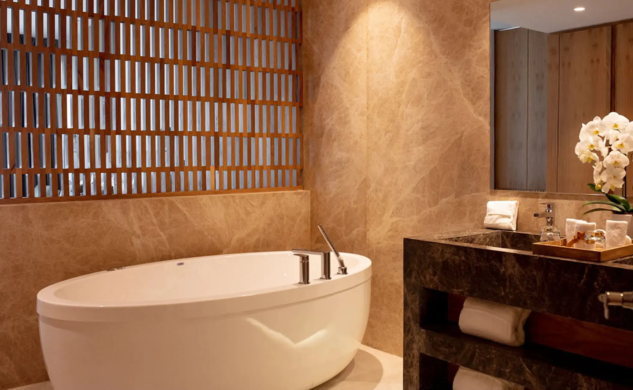 Soaking tub and marble vanity in a suite at Secrets Bahia Mita, Puerto Vallarta