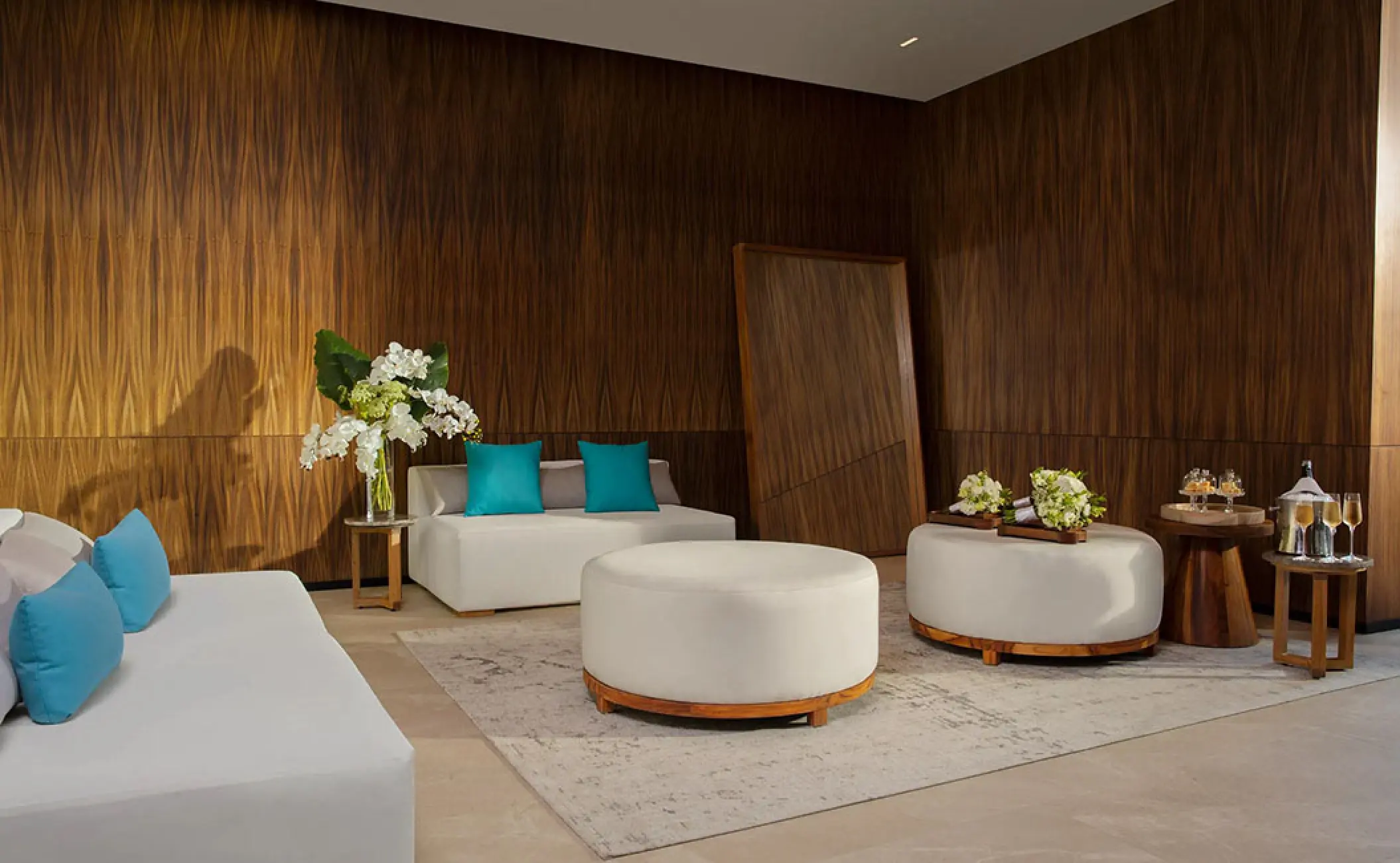 Bridal suite with wood paneled walls and white seating at Secrets Bahia Mita, Puerto Vallarta
