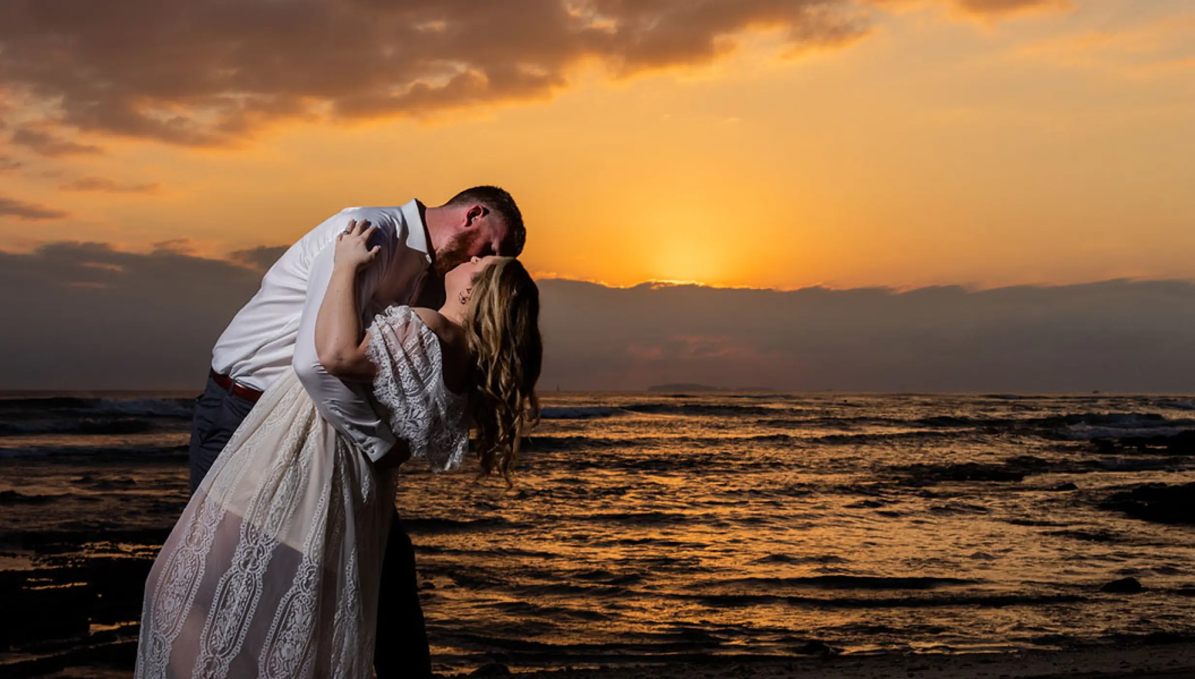 Couple kissing on sunset at Dreams Bahia Mita Surf and Spa