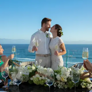 The bride and groom sharing a toast at Secrets Bahia Mita, Puerto Vallarta
