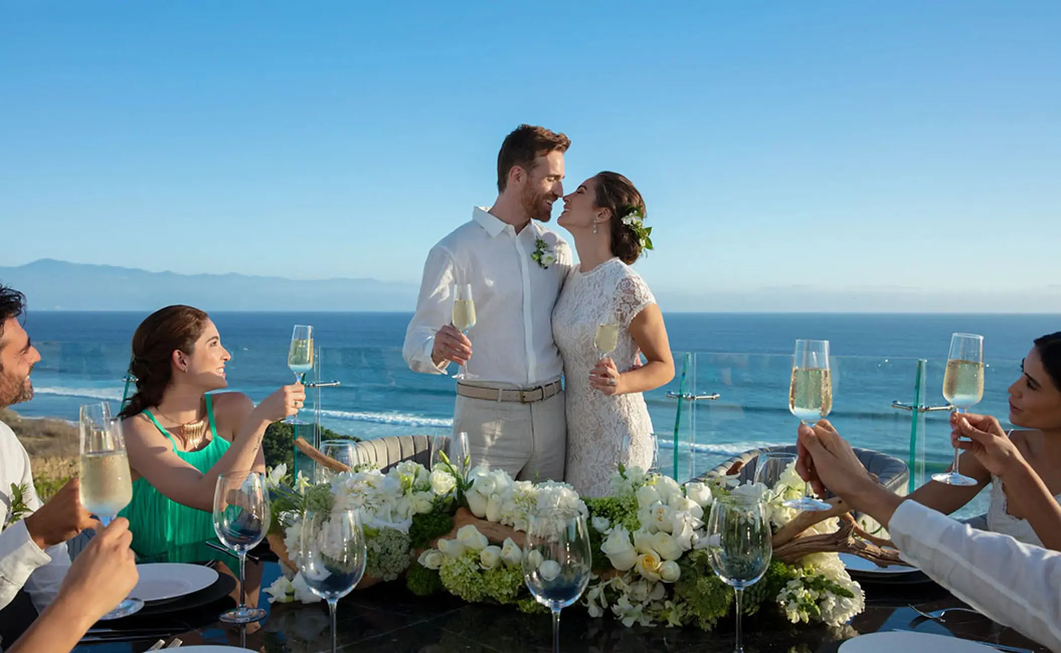 Bride and groom toasting with guests at a wedding reception at Secrets Bahia Mita, Puerto Vallarta