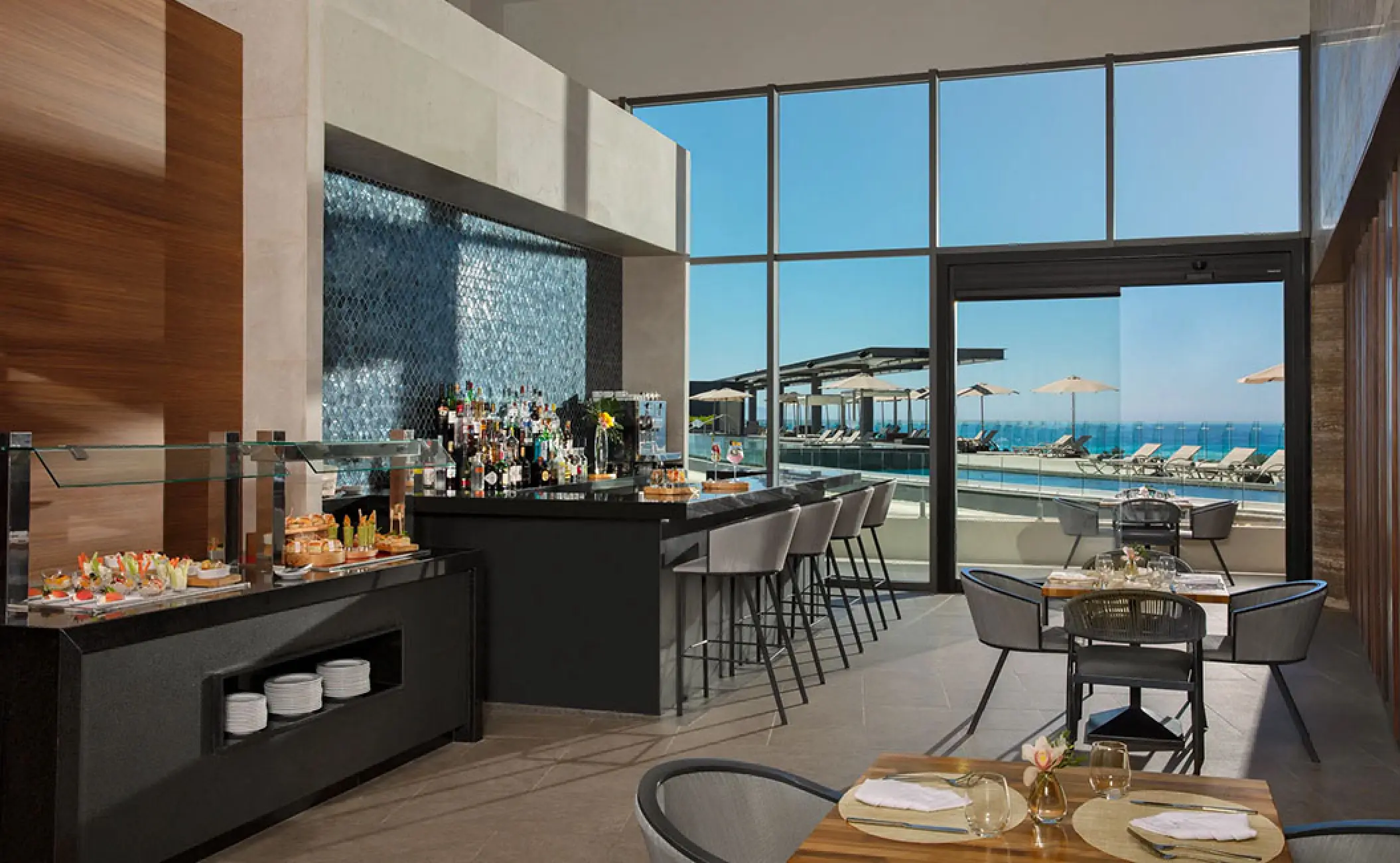 Modern bar and lounge area at Secrets Bahia Mita, Puerto Vallarta