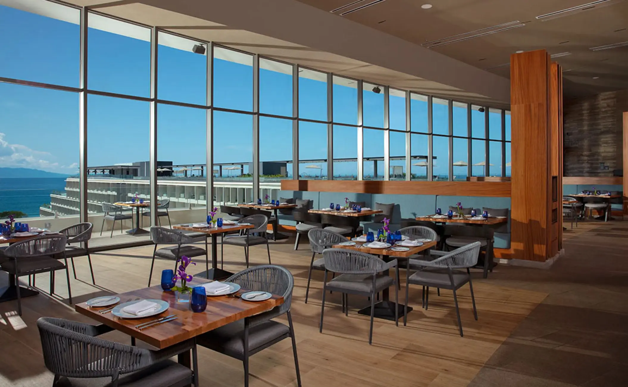 Market Cafe restaurant with floor-to-ceiling windows at Secrets Bahia Mita, Puerto Vallarta
