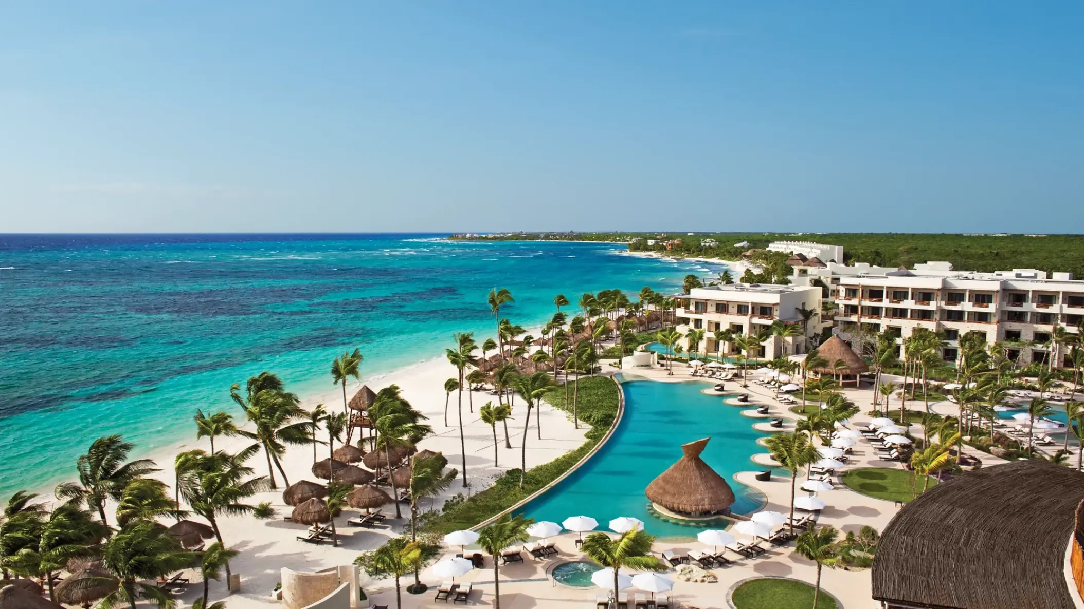 Aerial view of Secrets Akumal beachfront pools and turquoise Caribbean sea, Riviera Maya