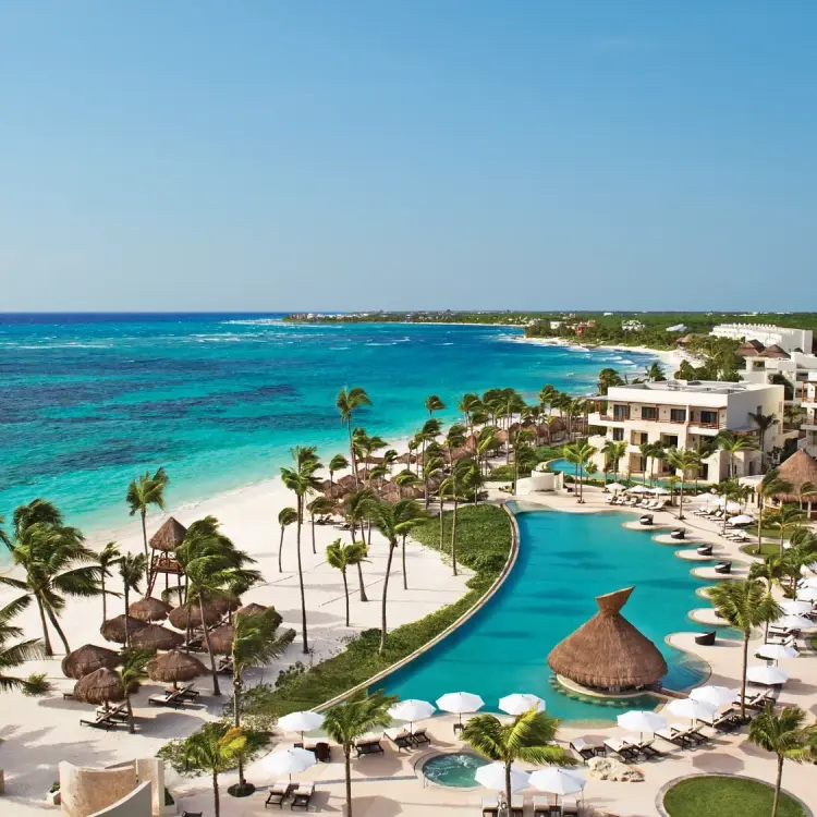 Aerial view of Secrets Akumal beachfront pools and turquoise Caribbean sea, Riviera Maya