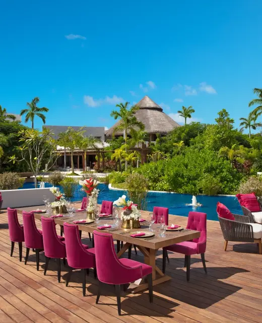 Dinner reception decor on coco cafe deck wedding venue at Secrets Akumal Riviera Maya