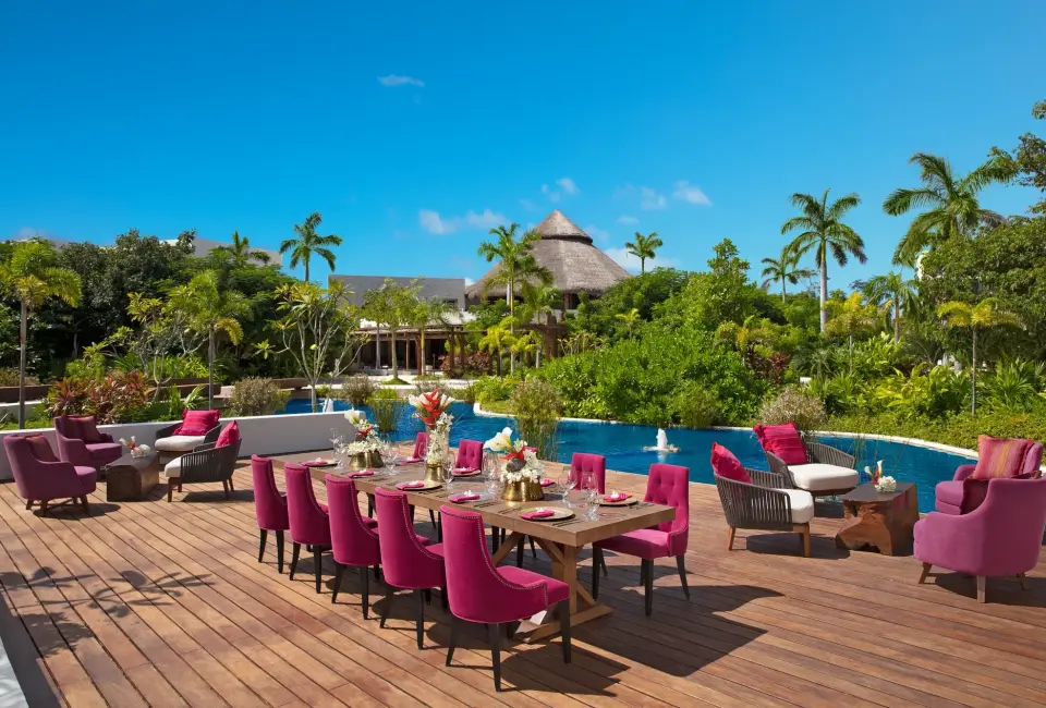 Dinner reception decor on coco cafe deck wedding venue at Secrets Akumal Riviera Maya