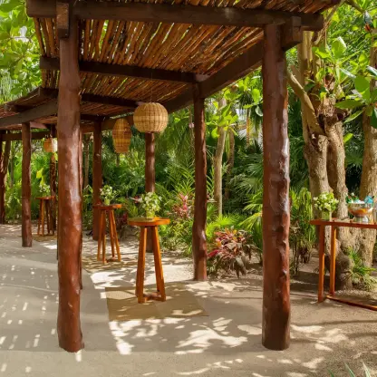 Cocktail party setup on secret garden at Secrets Akumal Riviera Maya