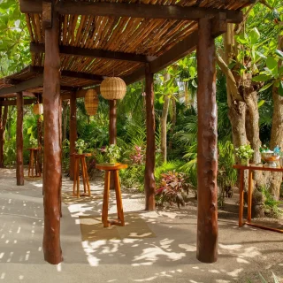 Cocktail party setup on secret garden at Secrets Akumal Riviera Maya
