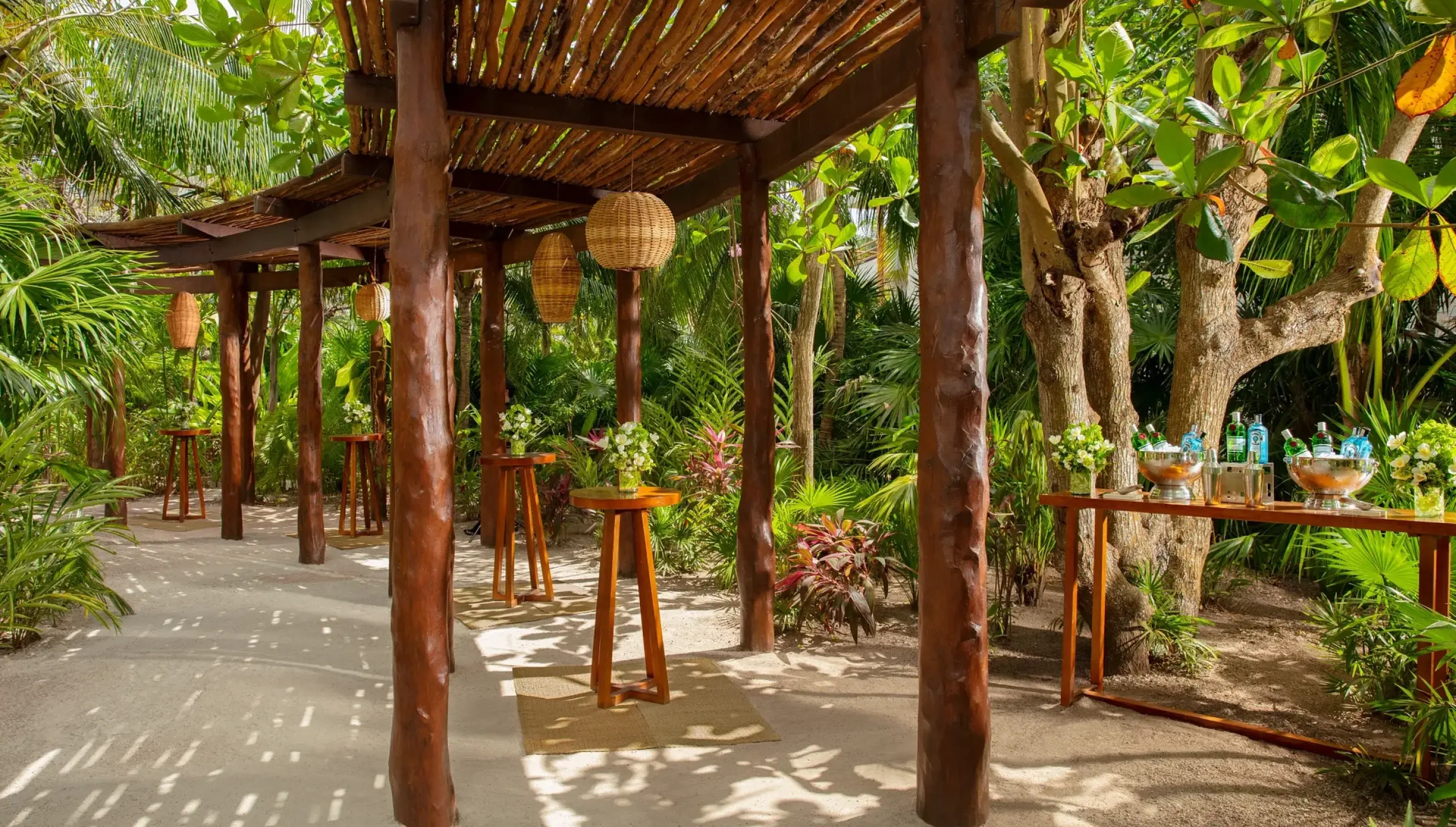 Cocktail party setup on secret garden at Secrets Akumal Riviera Maya