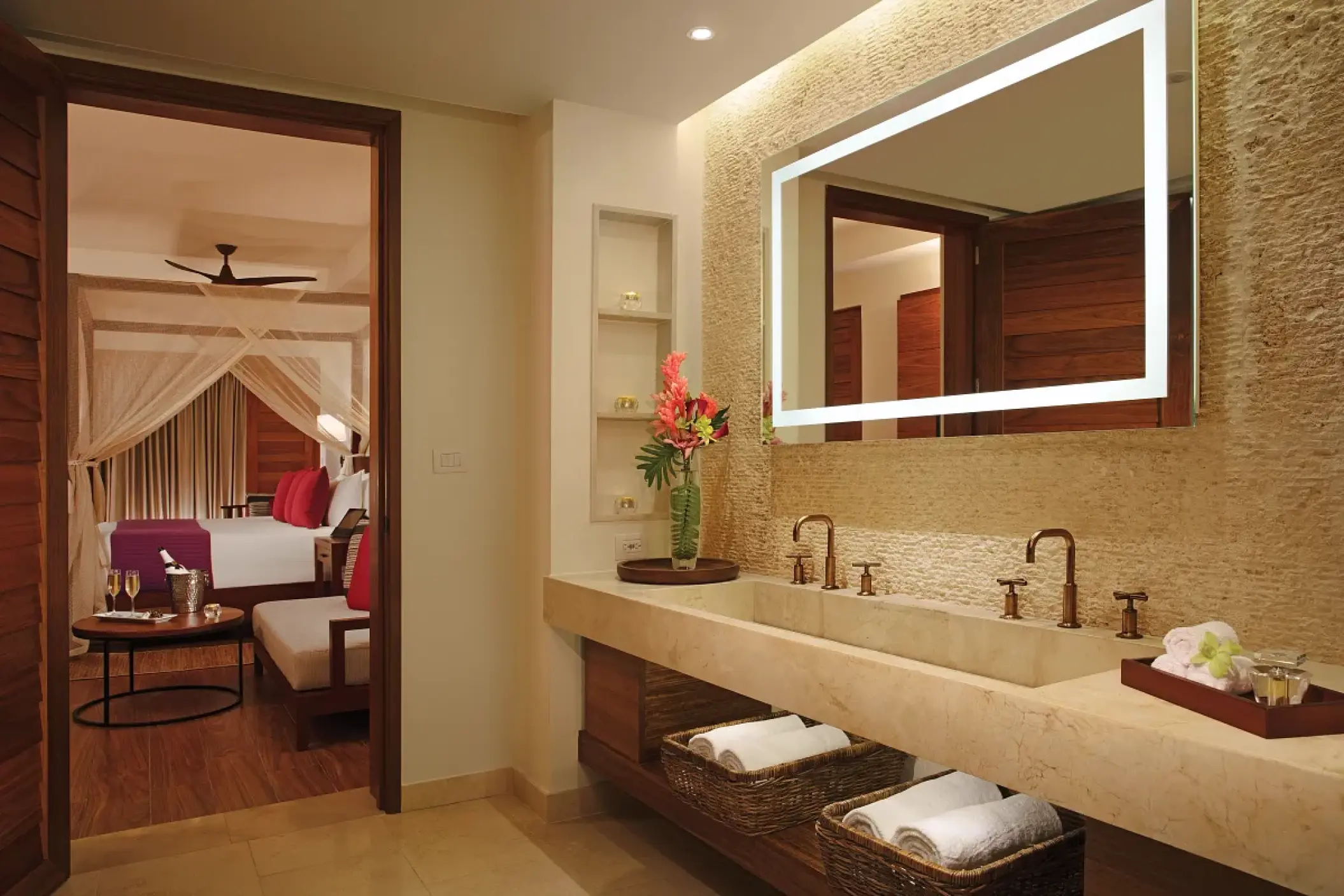 Secrets Cap Cana bungalow bathroom with dual sinks and backlit mirror leading into the master bedroom, Punta Cana