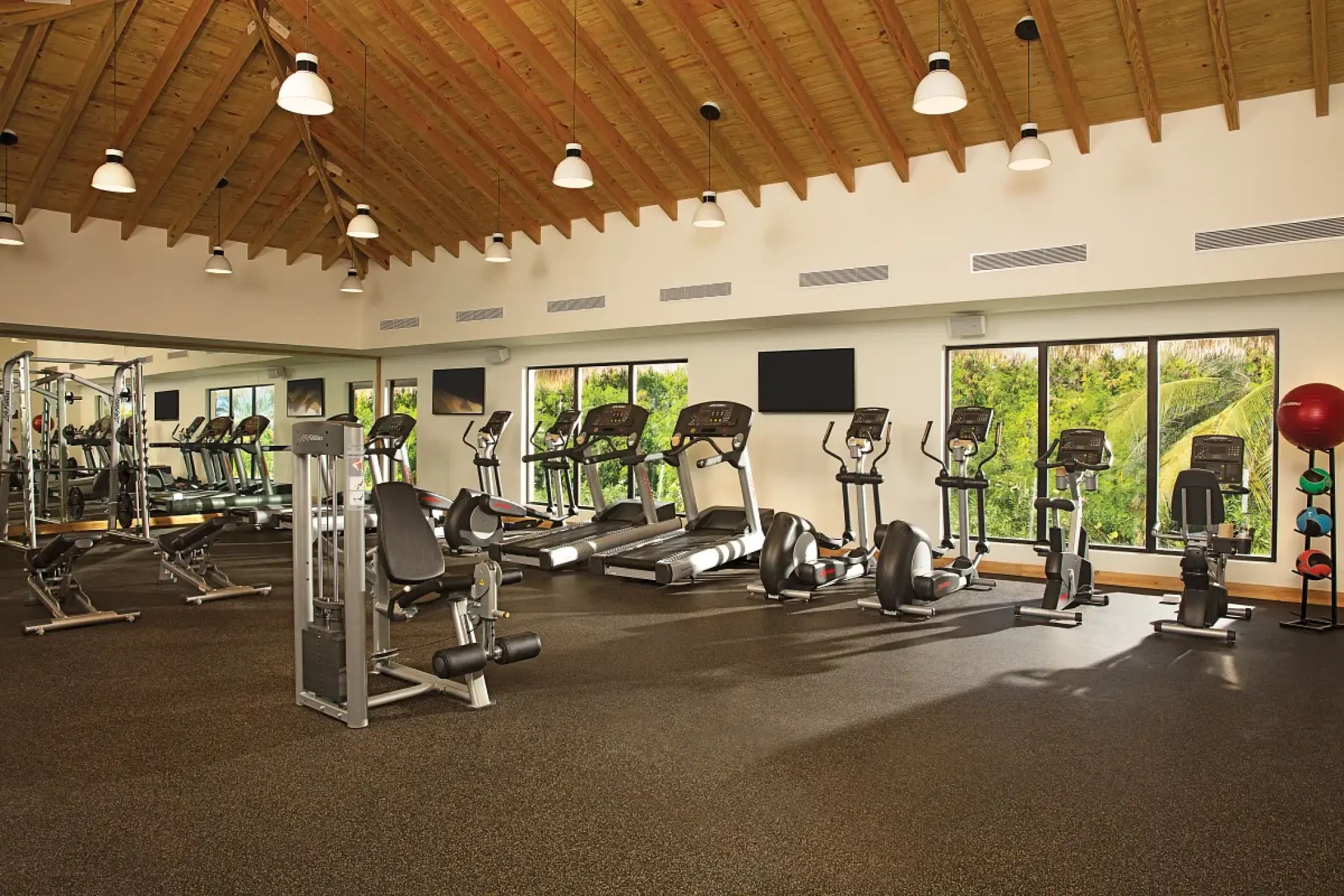 Fitness center with treadmills and cardio equipment at Secrets Cap Cana, Punta Cana