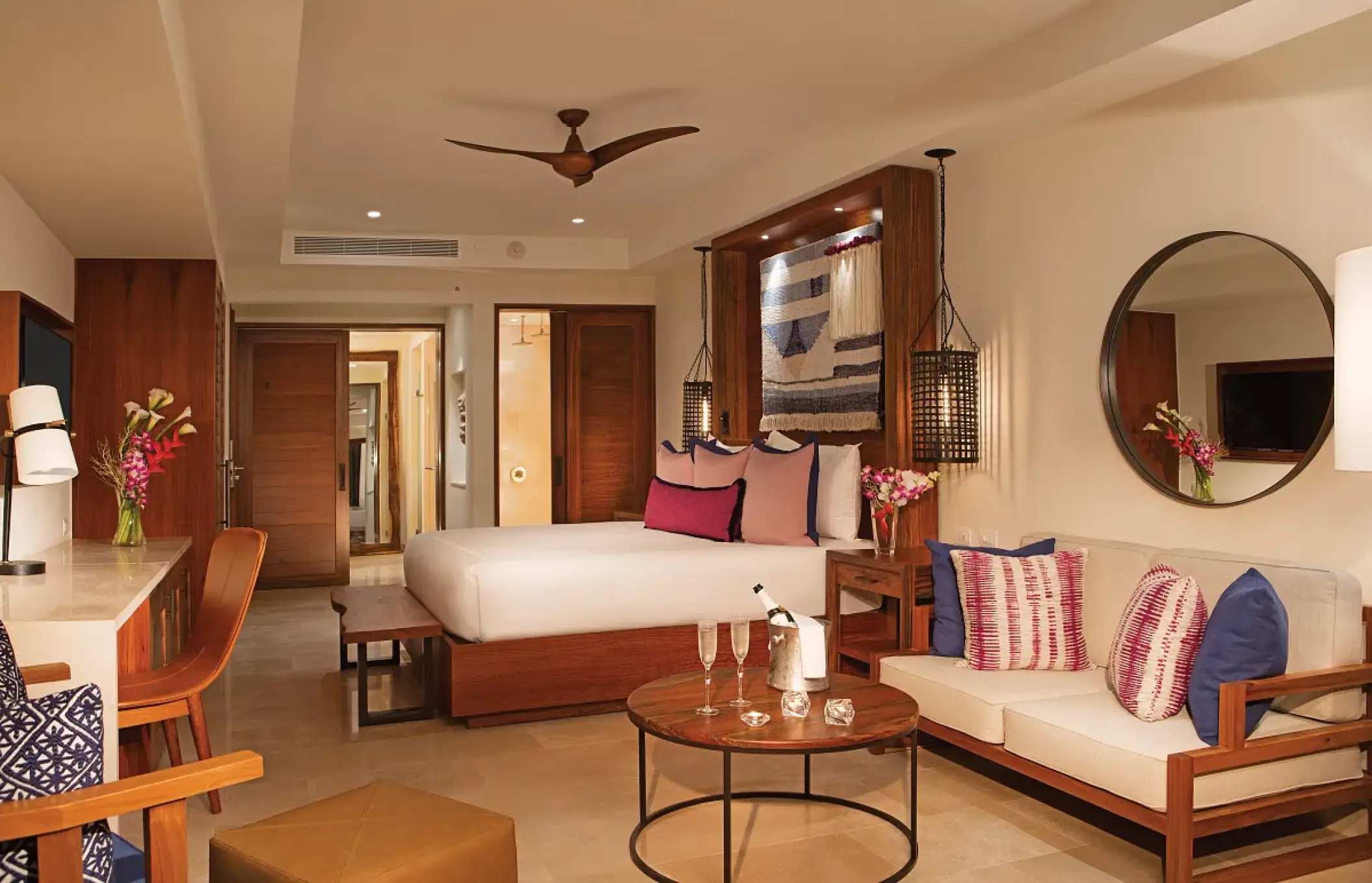 Junior suite with king bed and lounge area at Secrets Cap Cana, Punta Cana