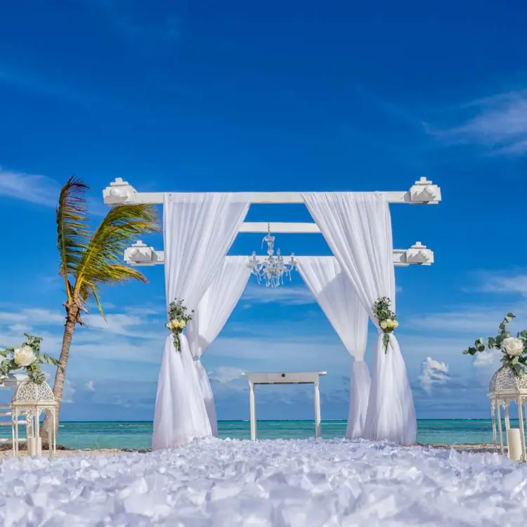 Beachfront wedding ceremony setup at Secrets Cap Cana, Punta Cana