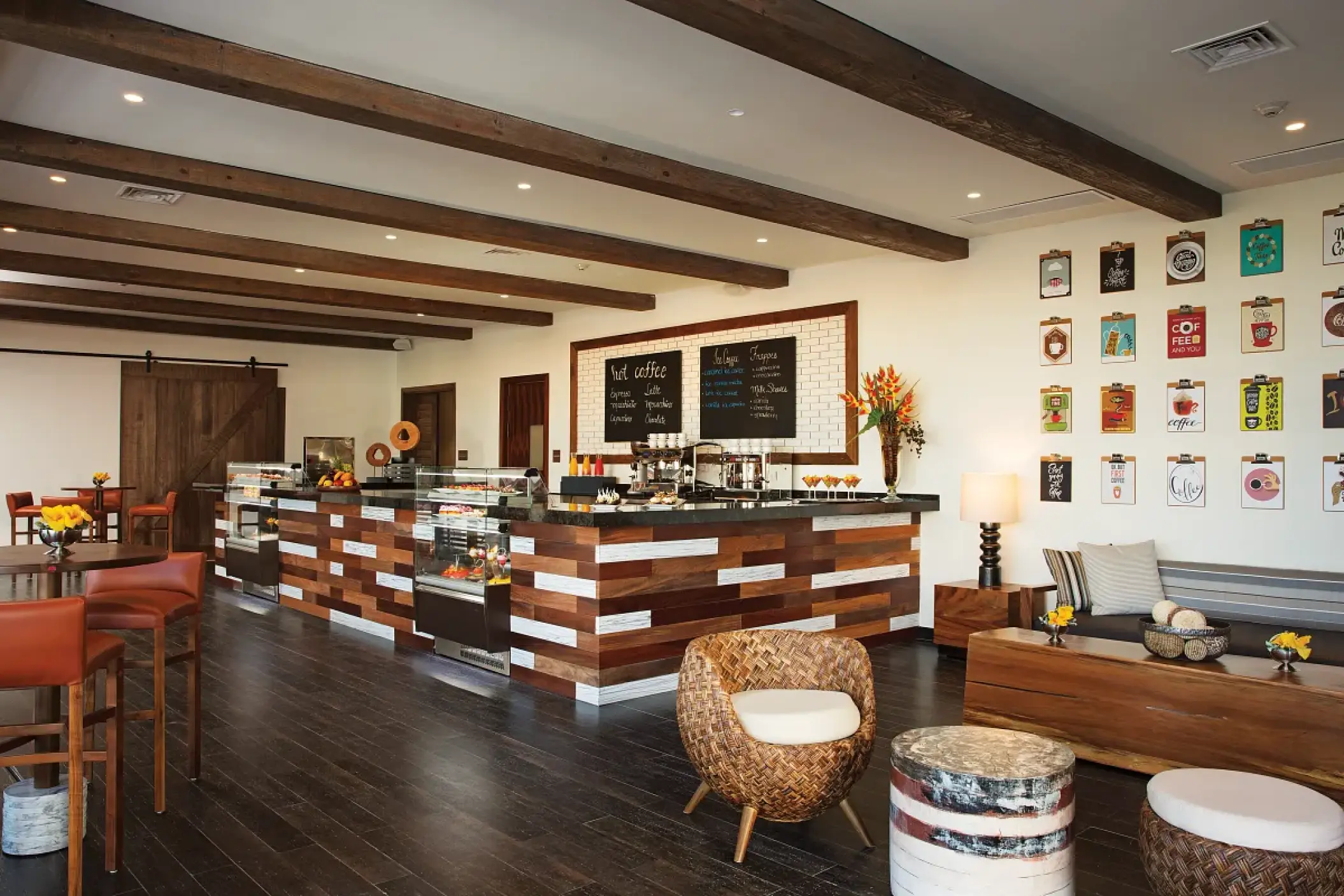 Coco Cafe interior with wood-paneled counter and seating area at Secrets Cap Cana, Punta Cana