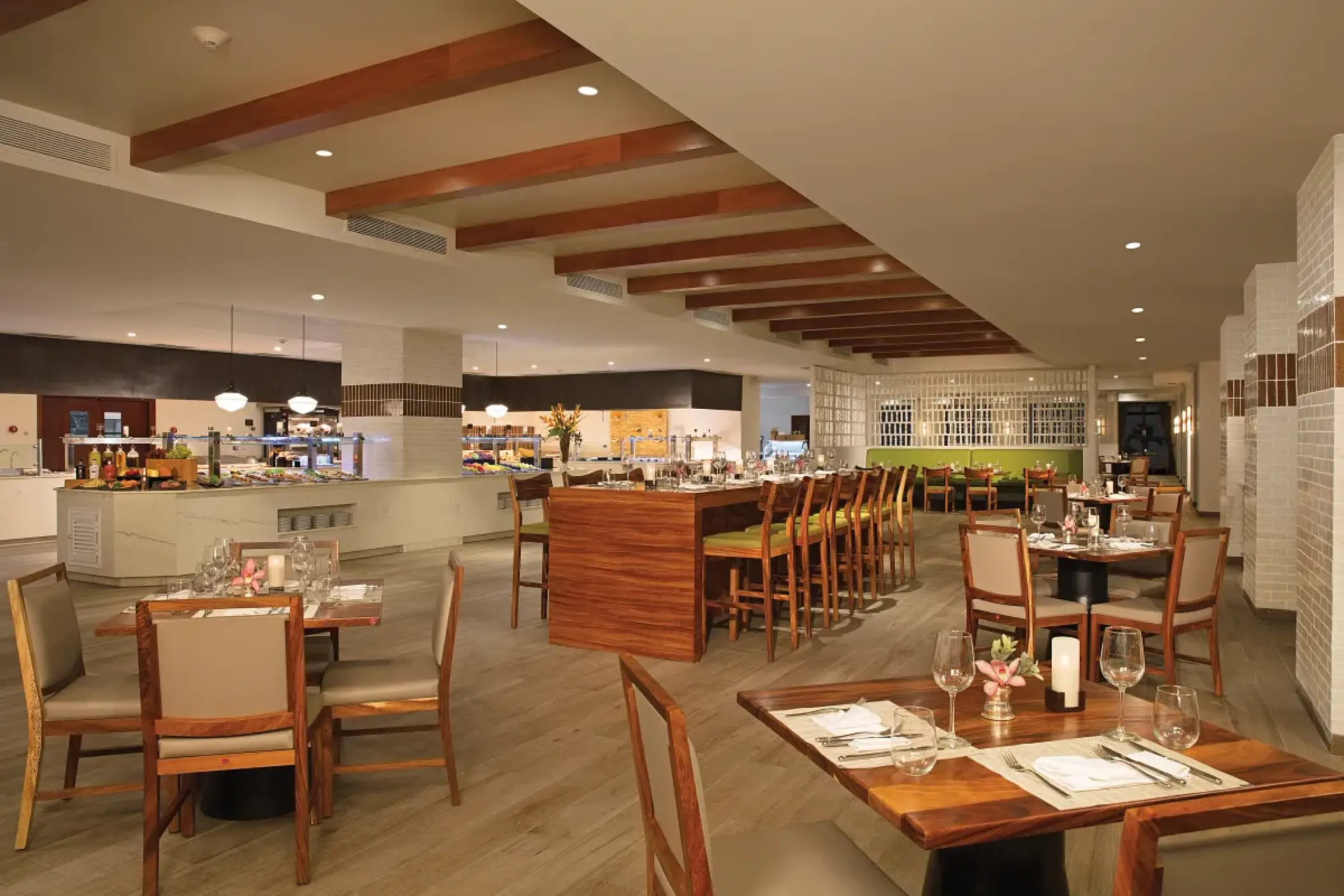 Market Cafe buffet area and dining tables at Secrets Cap Cana, Punta Cana
