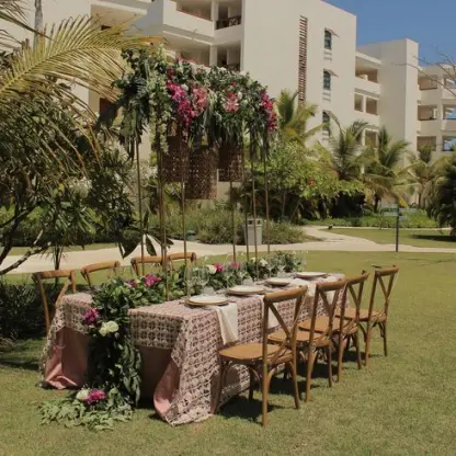 Garden wedding reception table with floral arch at Secrets Cap Cana, Punta Cana