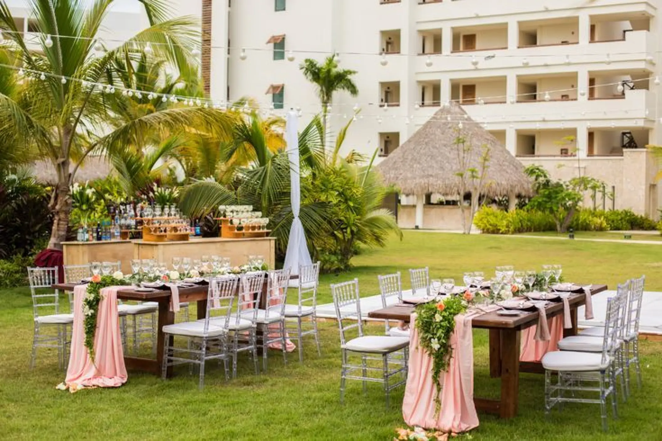 Outdoor wedding reception setup on the lawn at Secrets Cap Cana, Punta Cana