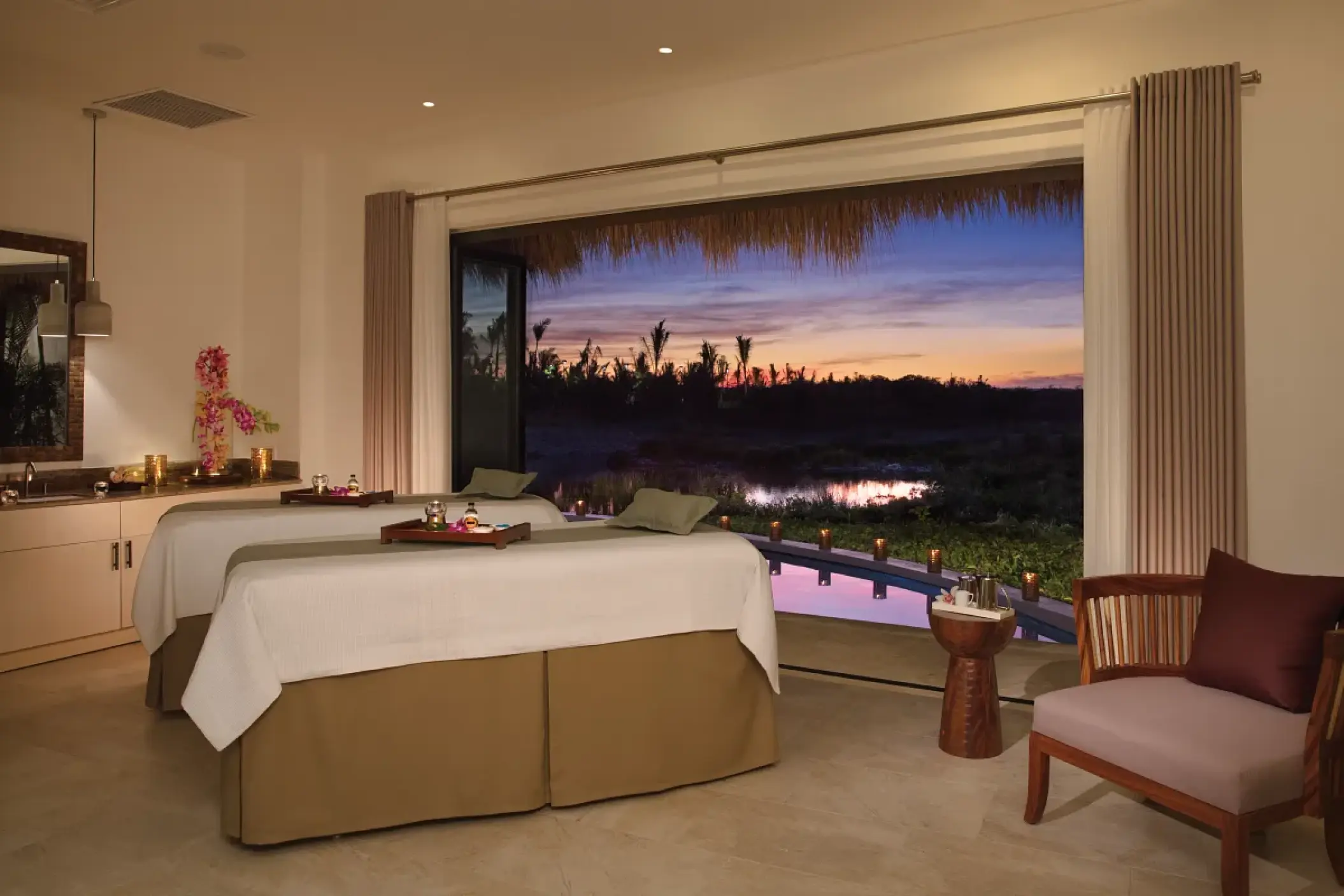 Couples spa treatment room with sunset views at Secrets Cap Cana, Punta Cana