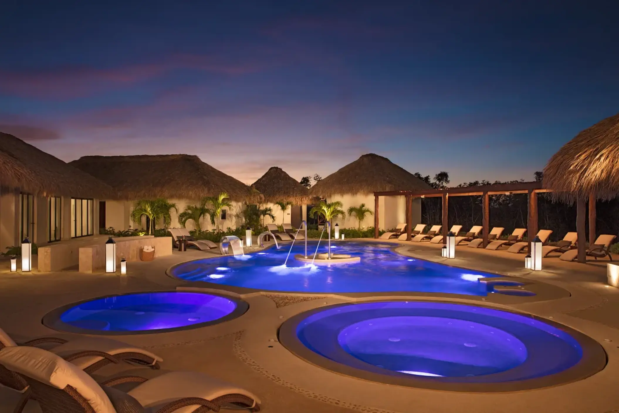 Illuminated hydrotherapy pool circuit at night, Secrets Cap Cana, Punta Cana