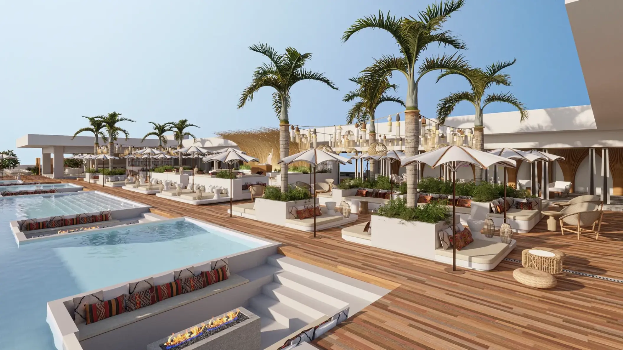 Rooftop lounge with pools, palm trees, and umbrellas at Impression Isla Mujeres by Secrets, Isla Mujeres