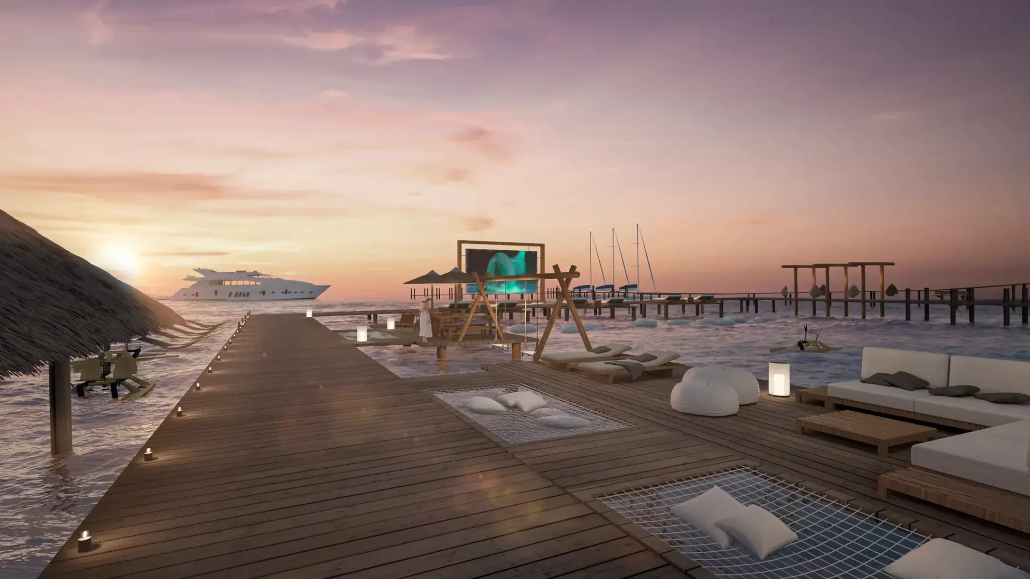 Waterfront lounge with overwater hammocks and a cinema screen at Impression Isla Mujeres by Secrets, Isla Mujeres