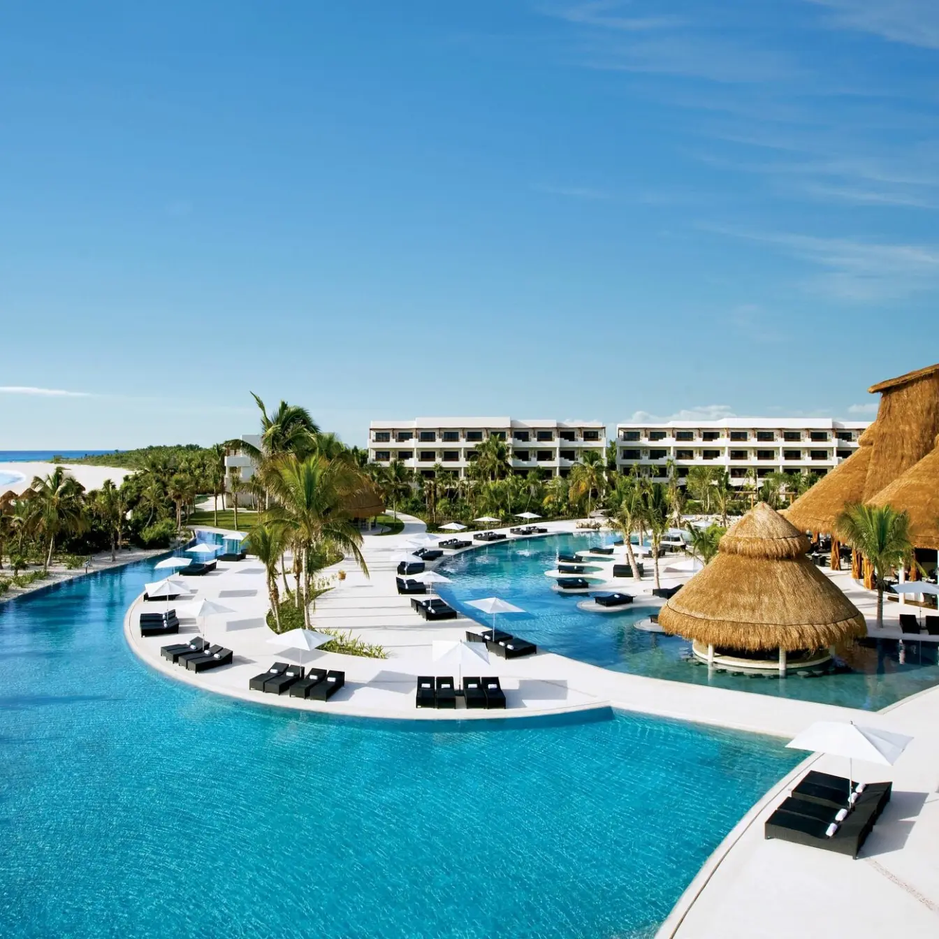 Aerial view of the swimming pools and beachfront at Secrets Maroma Beach, Riviera Maya